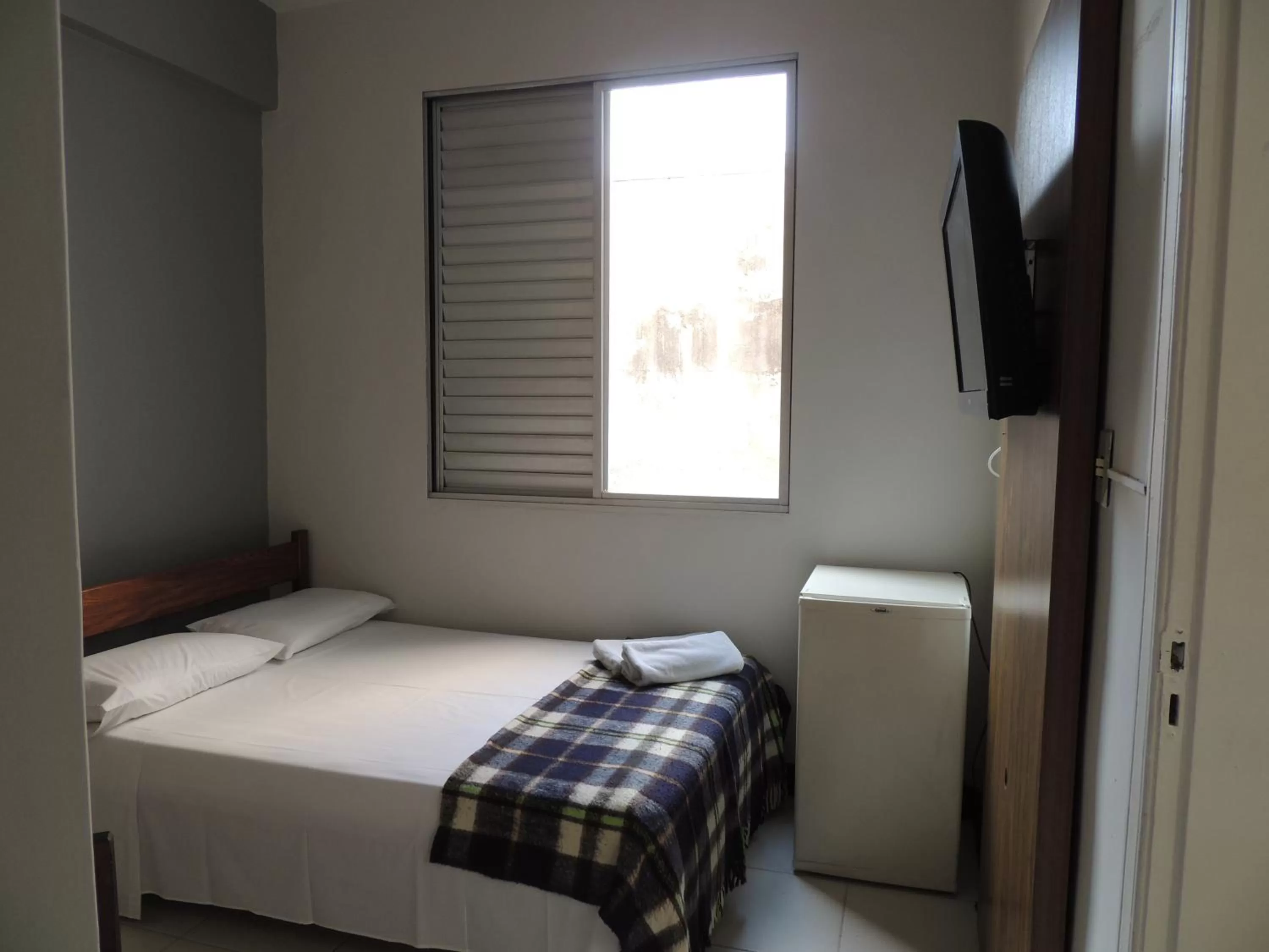 Bedroom, Bed in Hotel Economy 888 - Próximo a Praça da Estação e Rodoviária