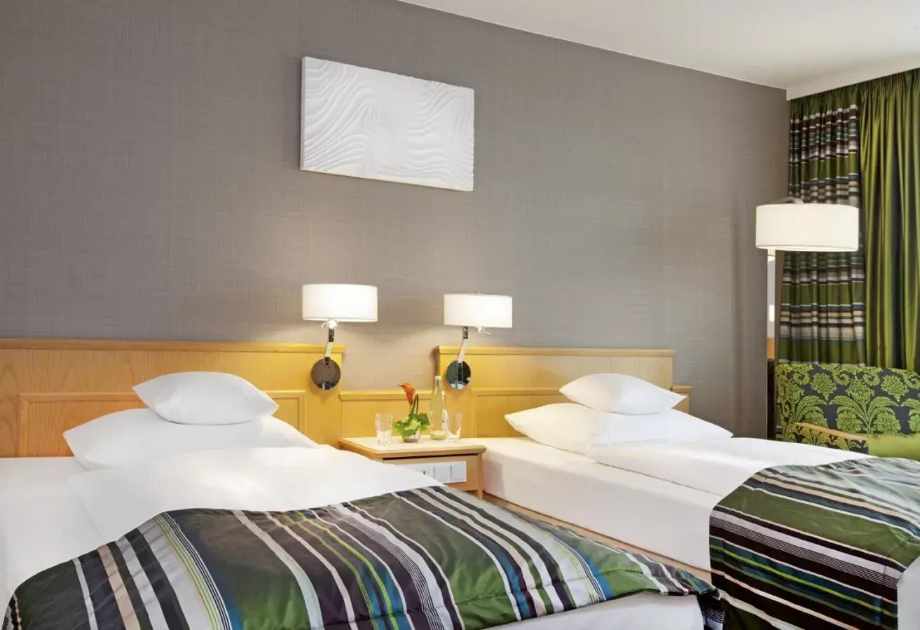 Photo of the whole room, Bed in Mövenpick Hotel Nürnberg Airport