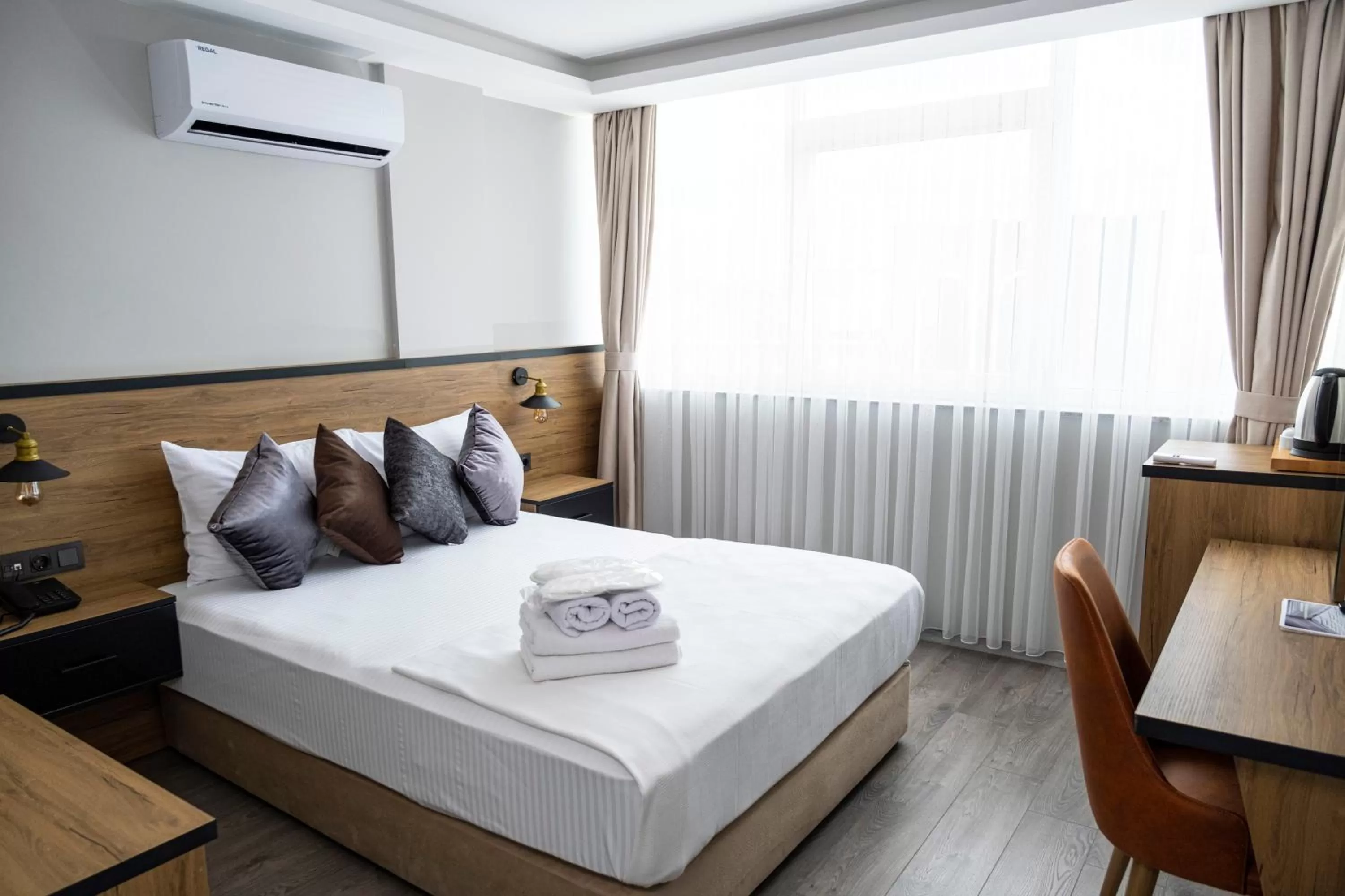 Bed in Comfort Center Suit Hotel