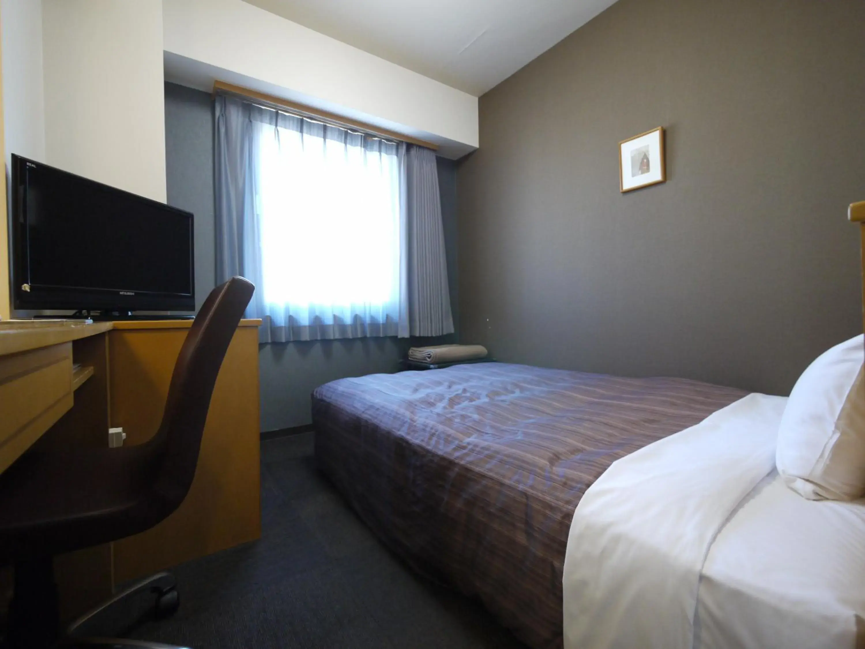 Photo of the whole room, Bed in Hotel Route Inn Obihiro Ekimae