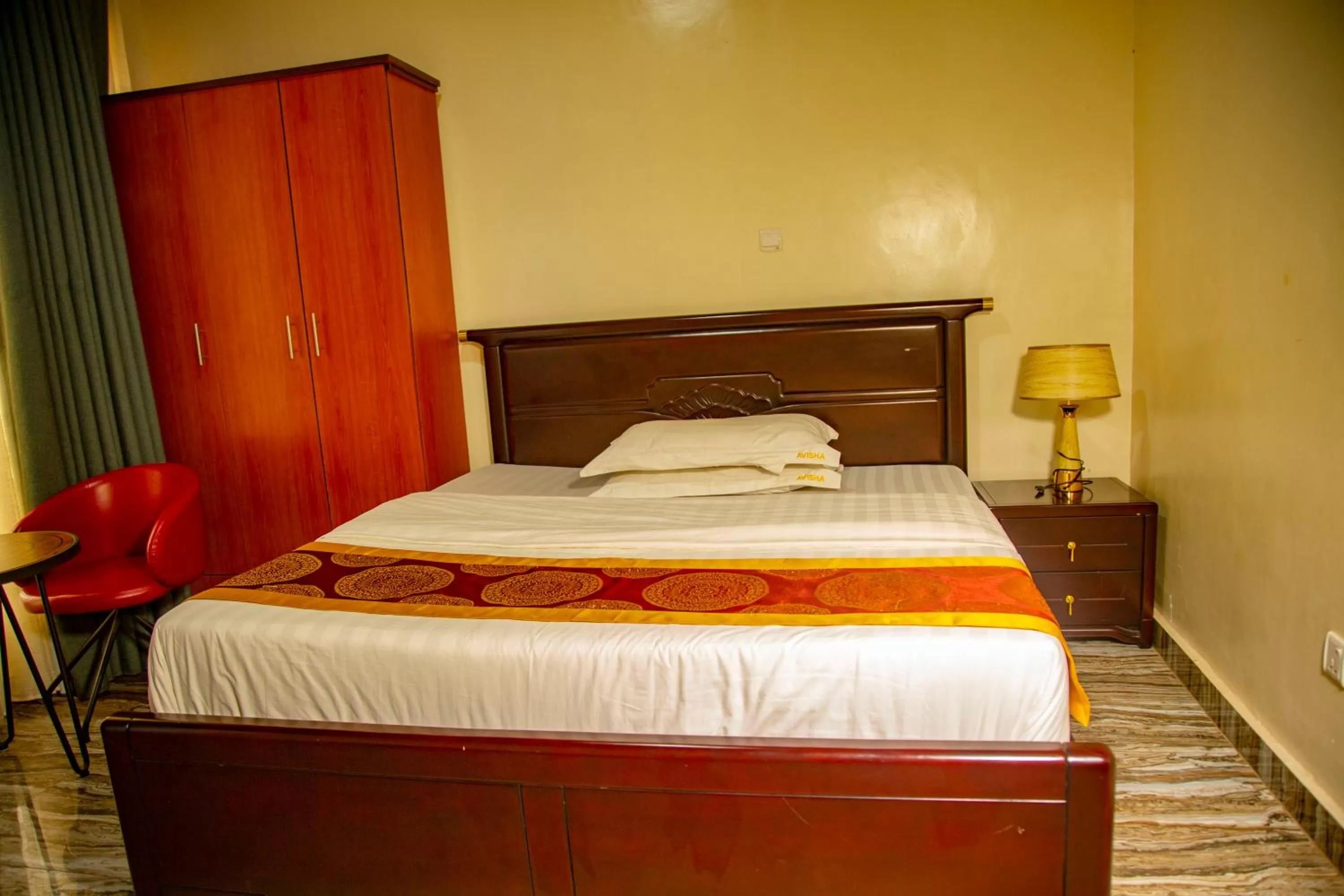 Bed in AVISHA TOWN HOTEL