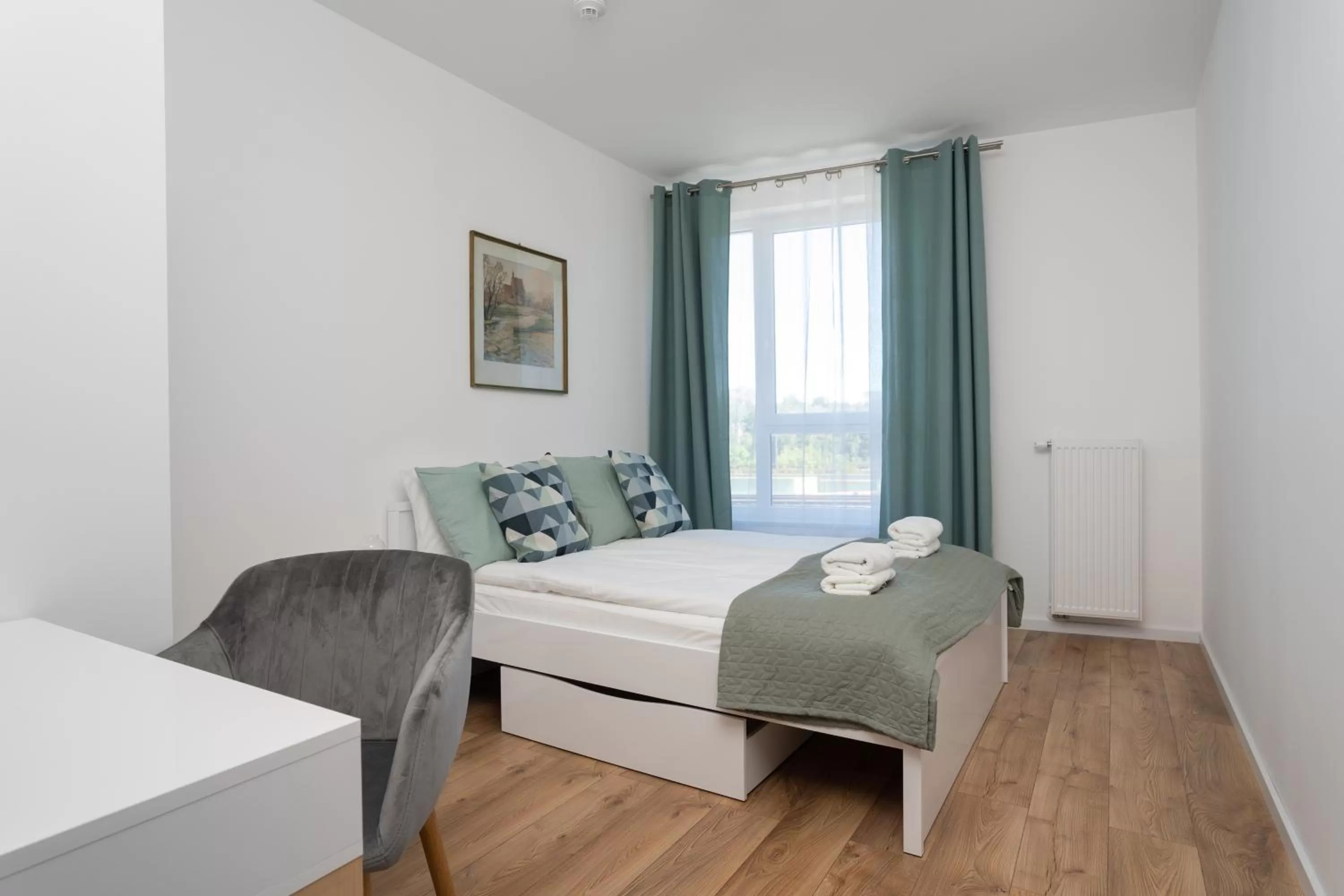 Bed in Symphony Modern Tower Apartamenty