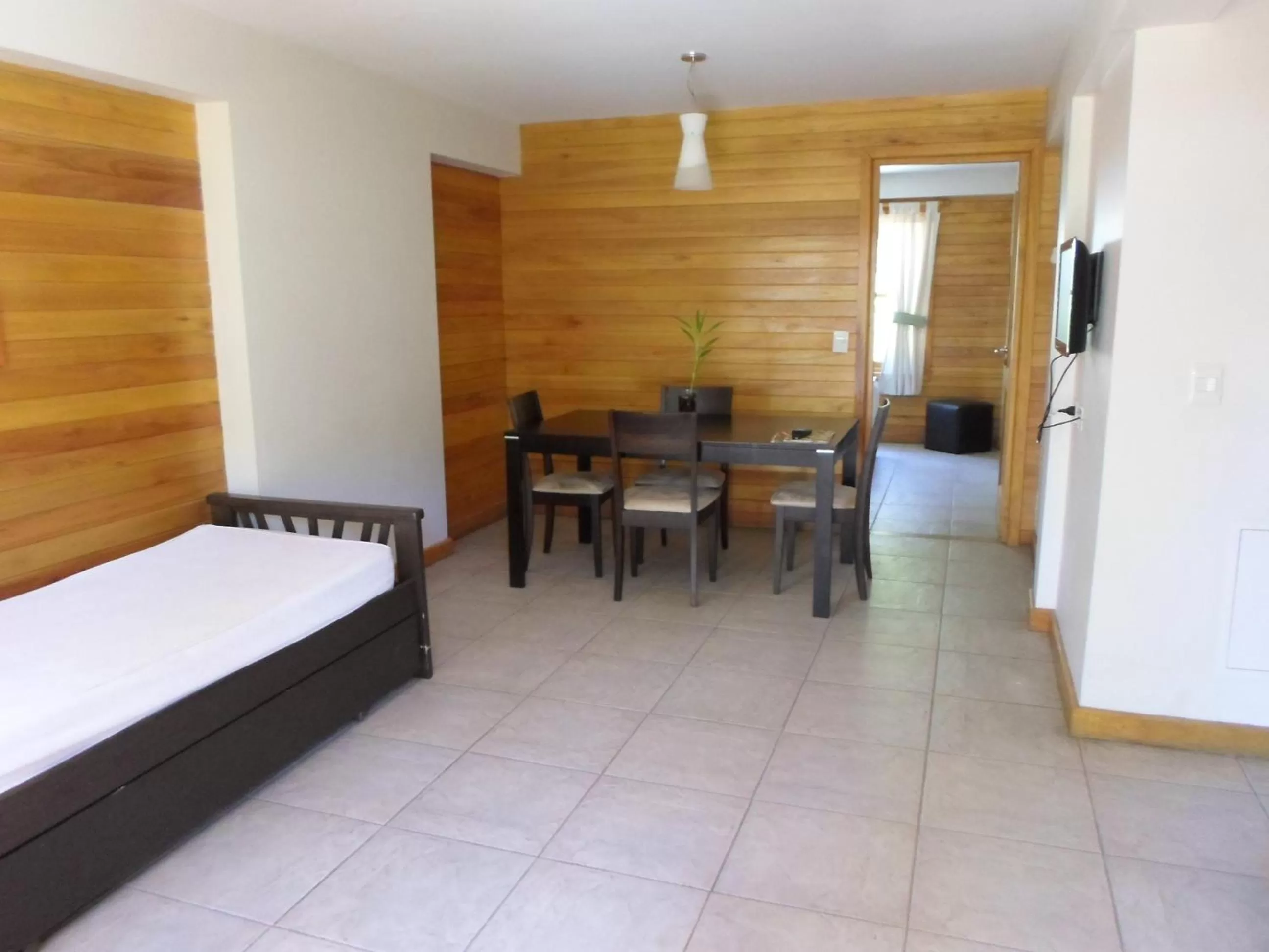 Living room, Bed in Apart Hotel Robles del Sur