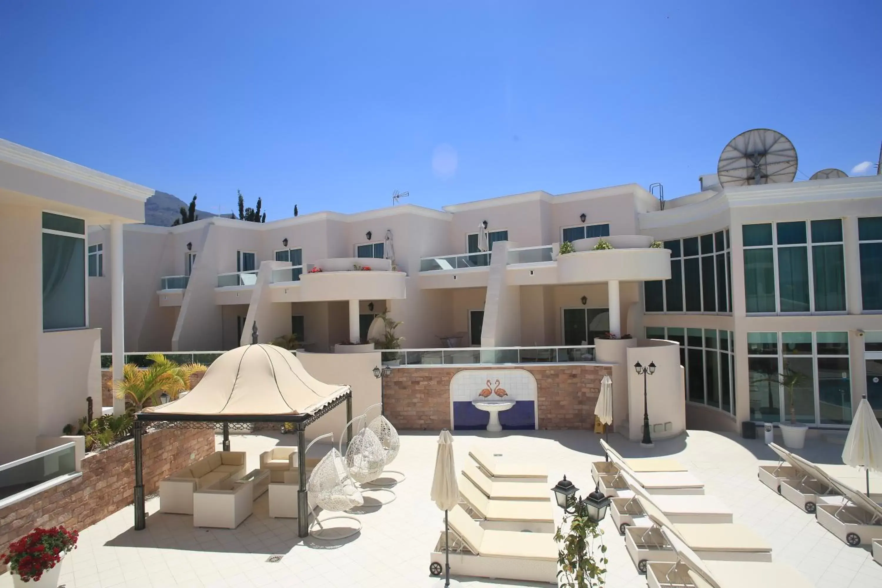 Patio, Property Building in Flamingo Suites Boutique Hotel