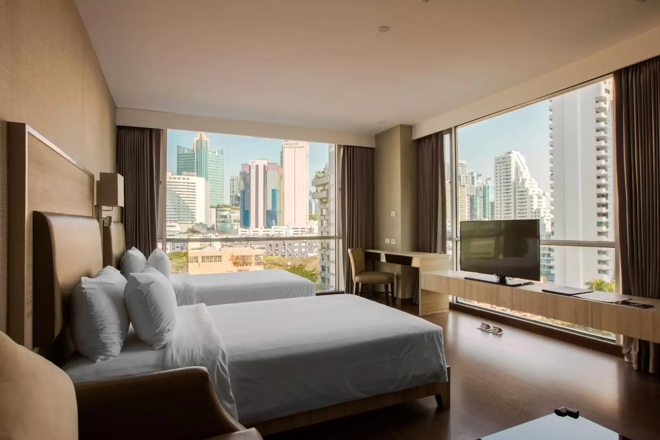 Bed in Adelphi Suites Bangkok - SHA Extra Plus