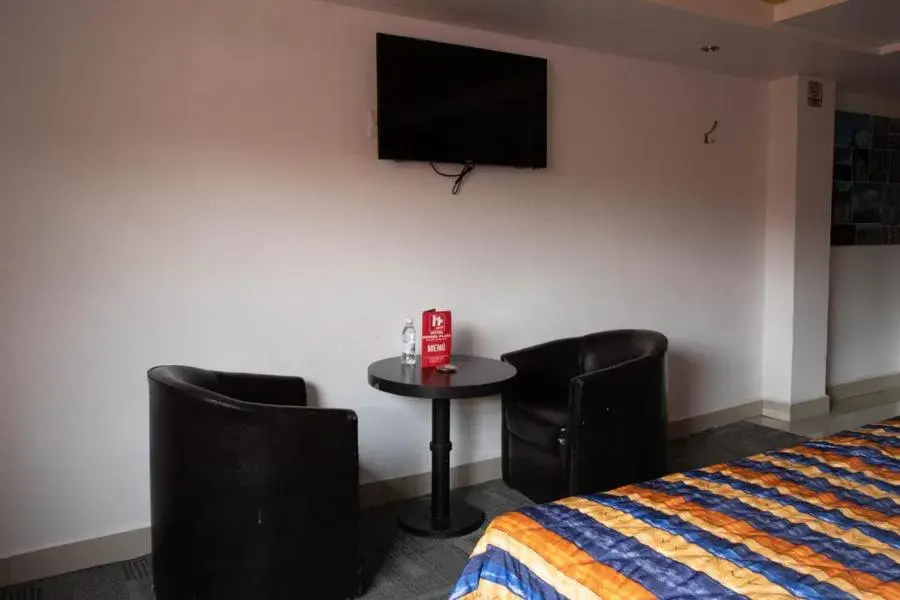 TV and multimedia, TV/Entertainment Center in Hotel Rossel Plaza