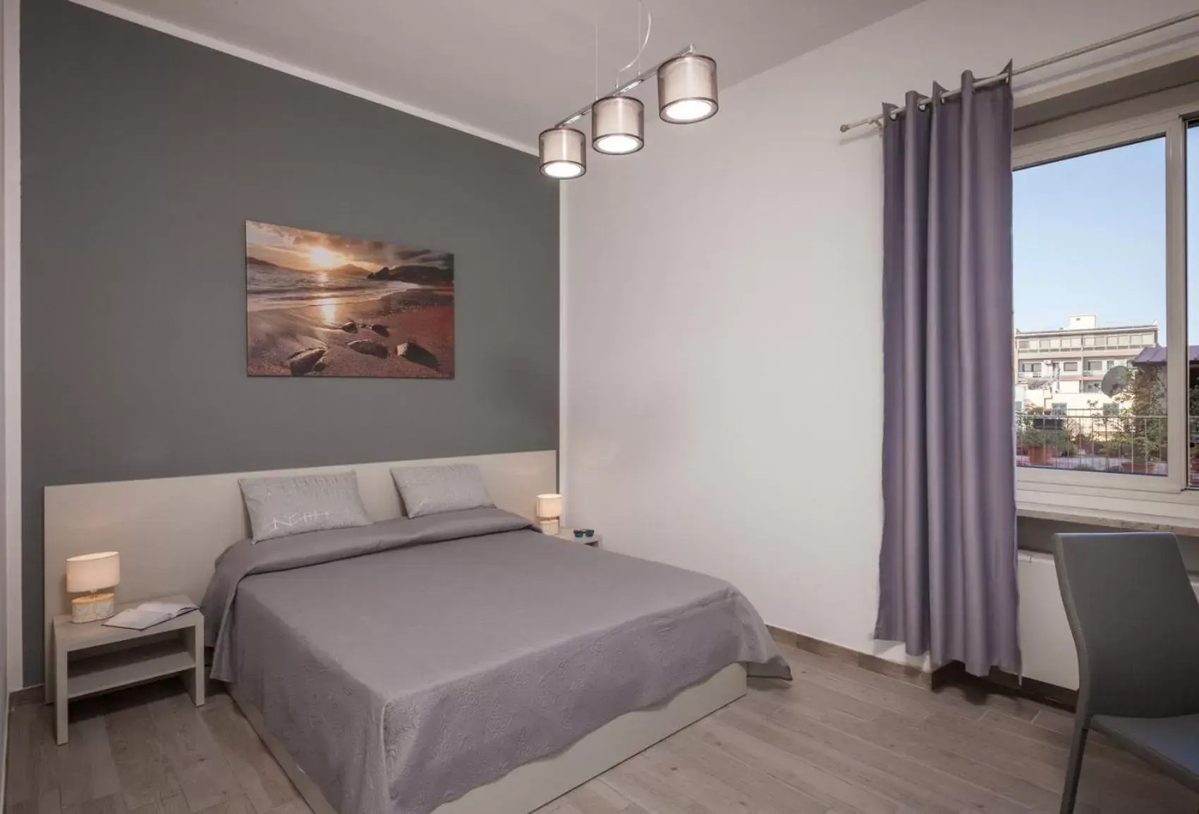 Bed in Ajana Rooms by Accomodo