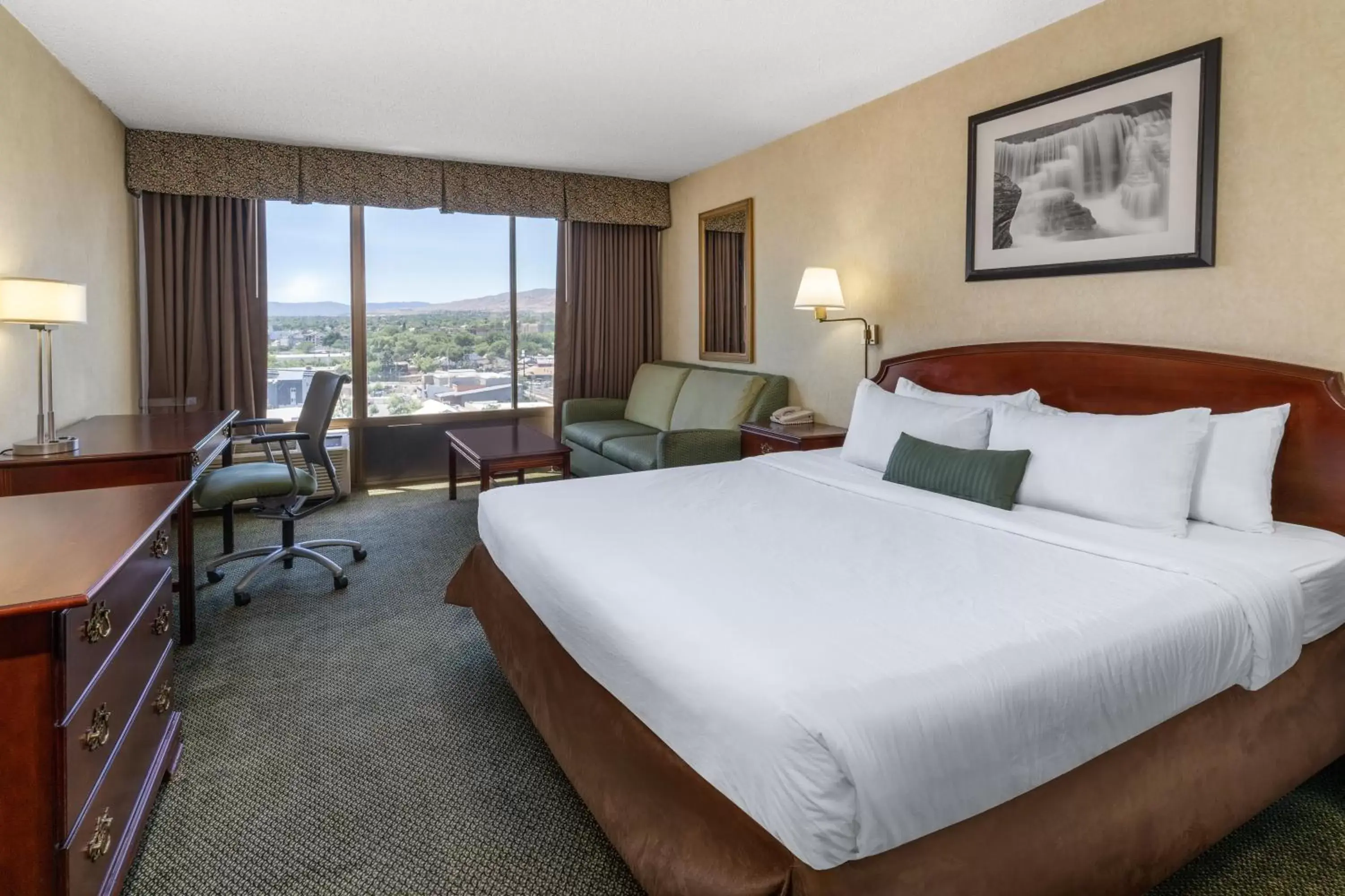Bed in Ramada by Wyndham Reno Hotel & Casino