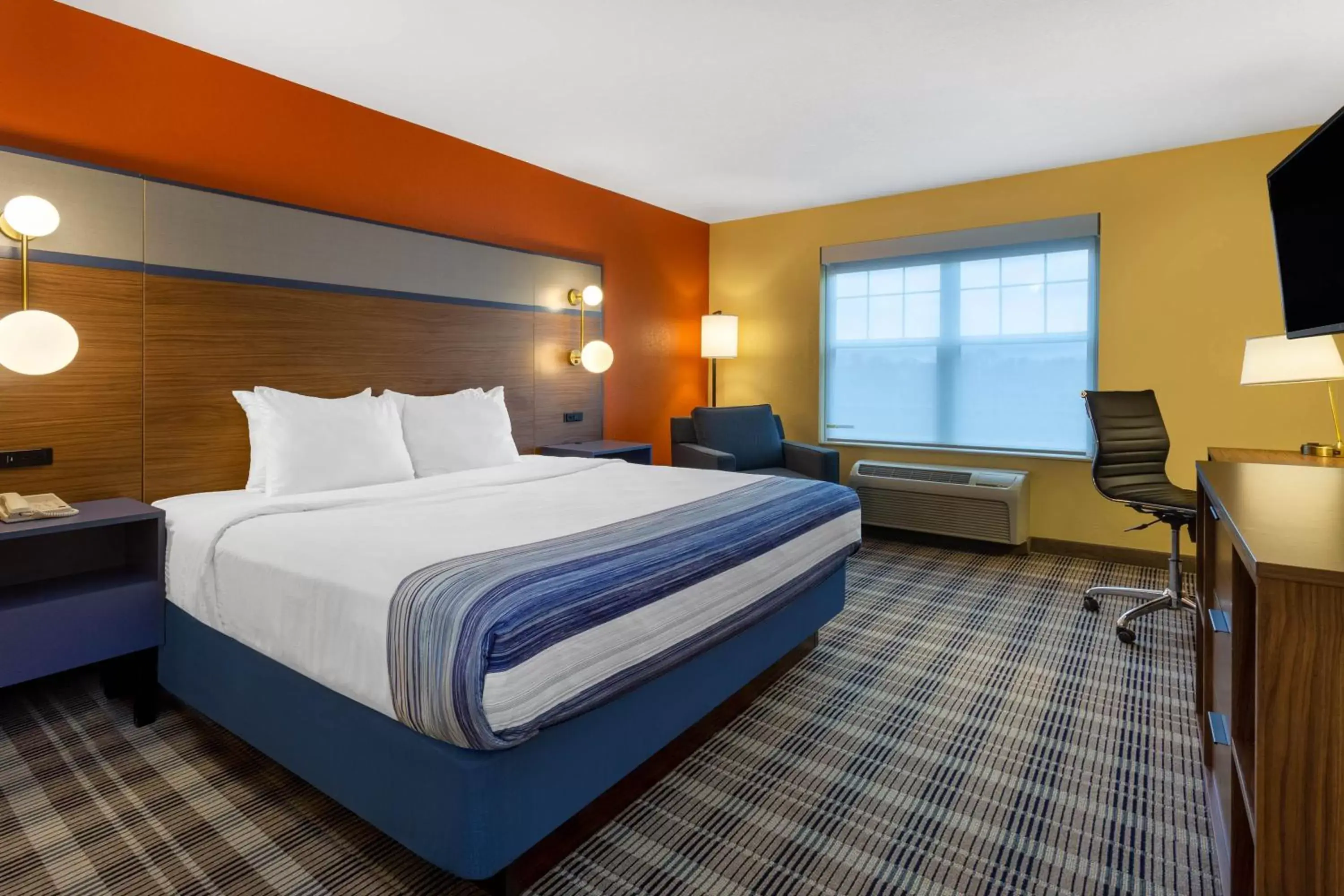 Bed in AmericInn by Wyndham Fulton Clinton