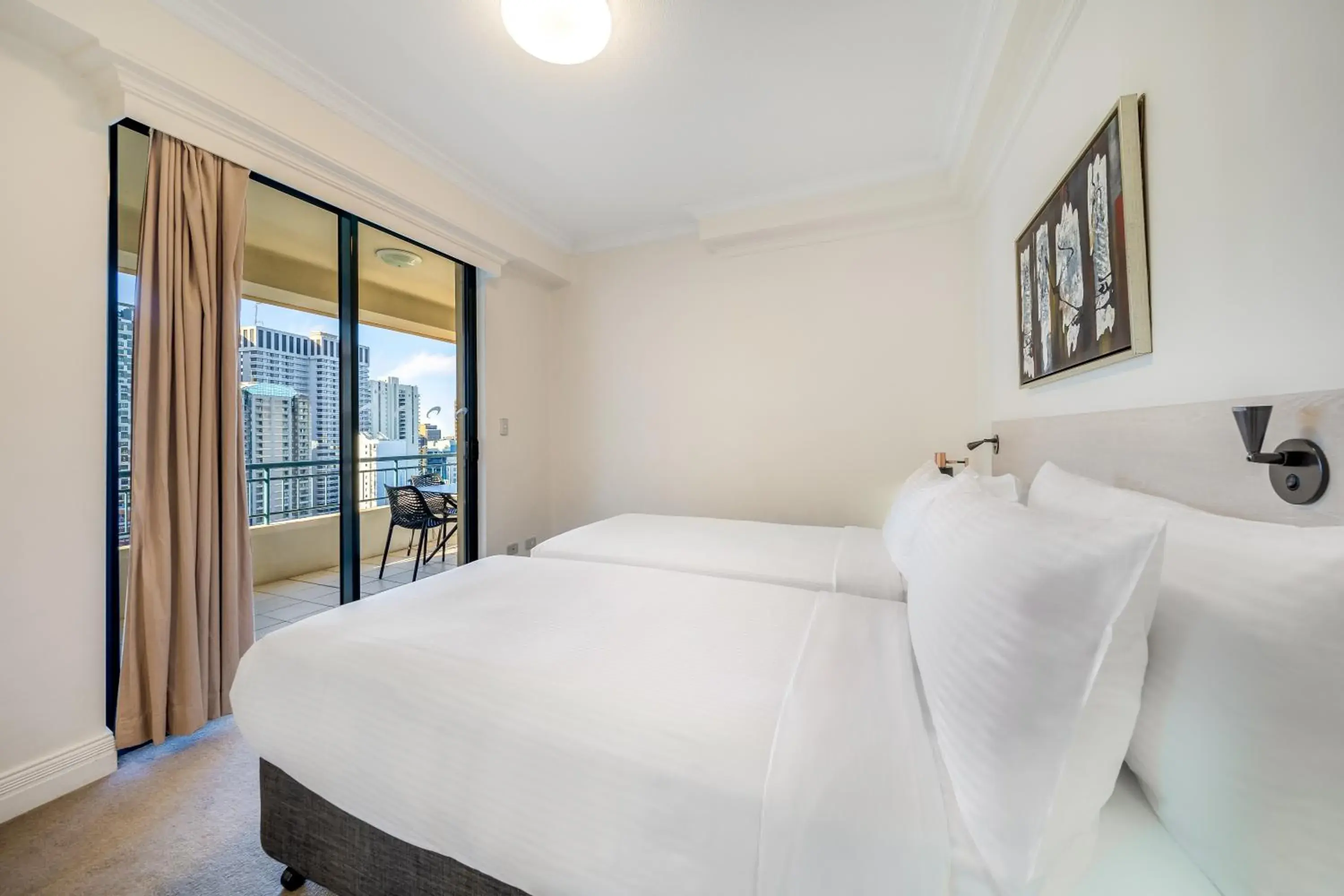 Bed in Oaks Sydney Castlereagh Suites