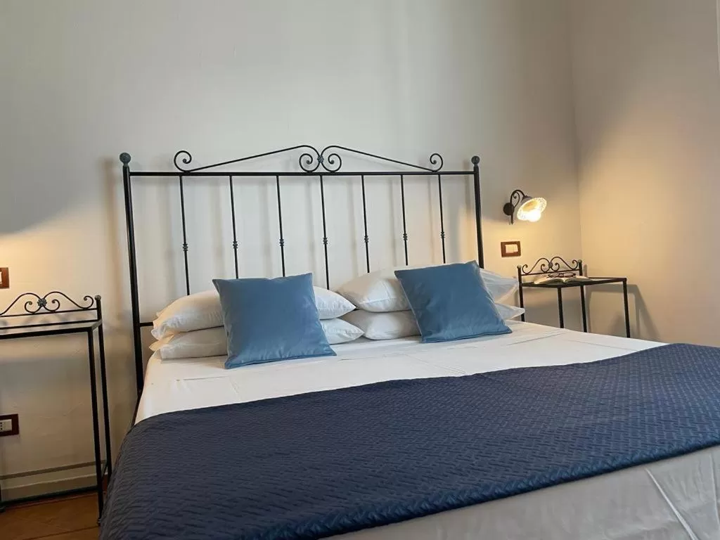 Bed in Ai Dammusi Rooms