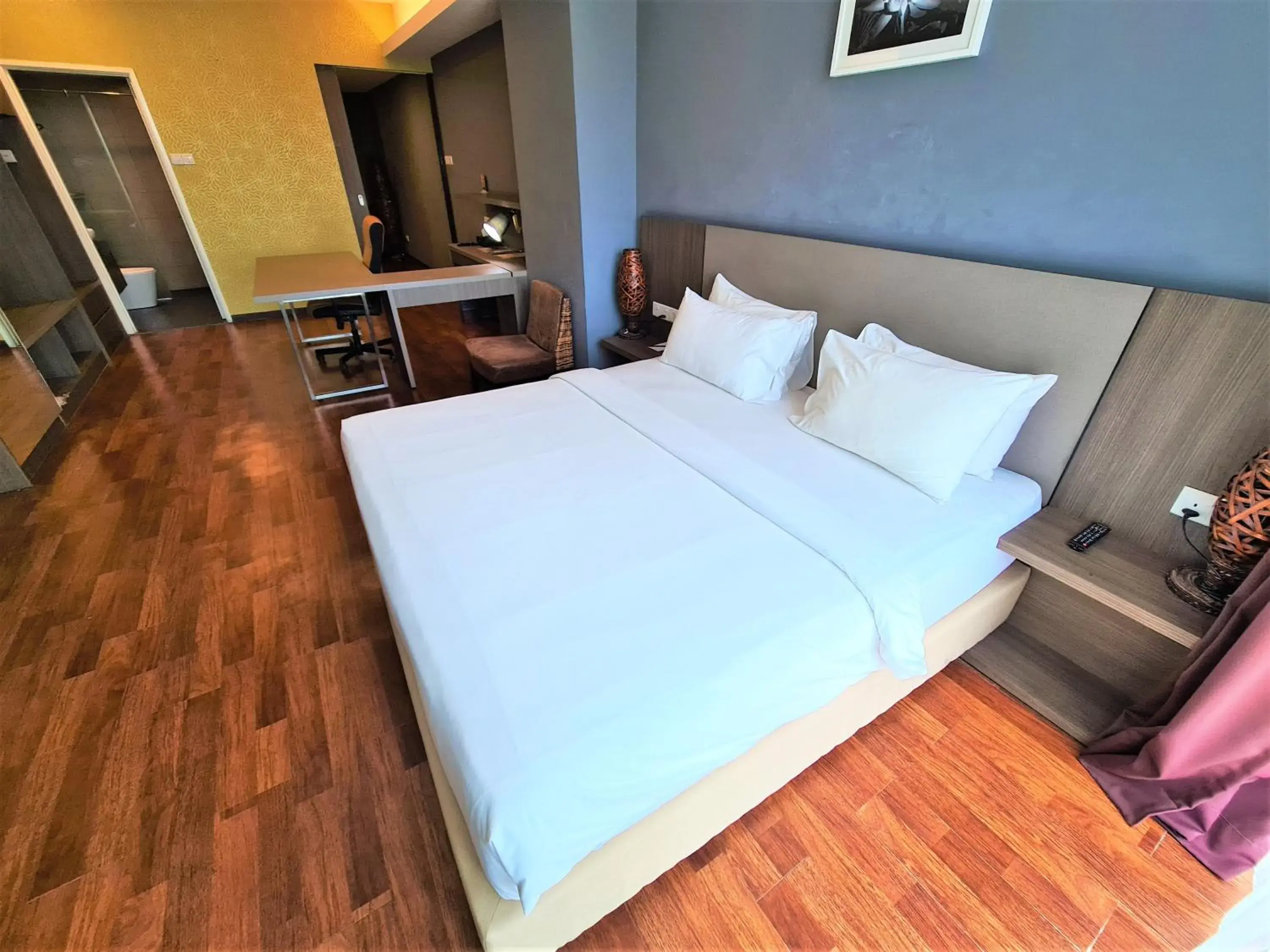 Bed in Nexus Regency Suites & Hotel