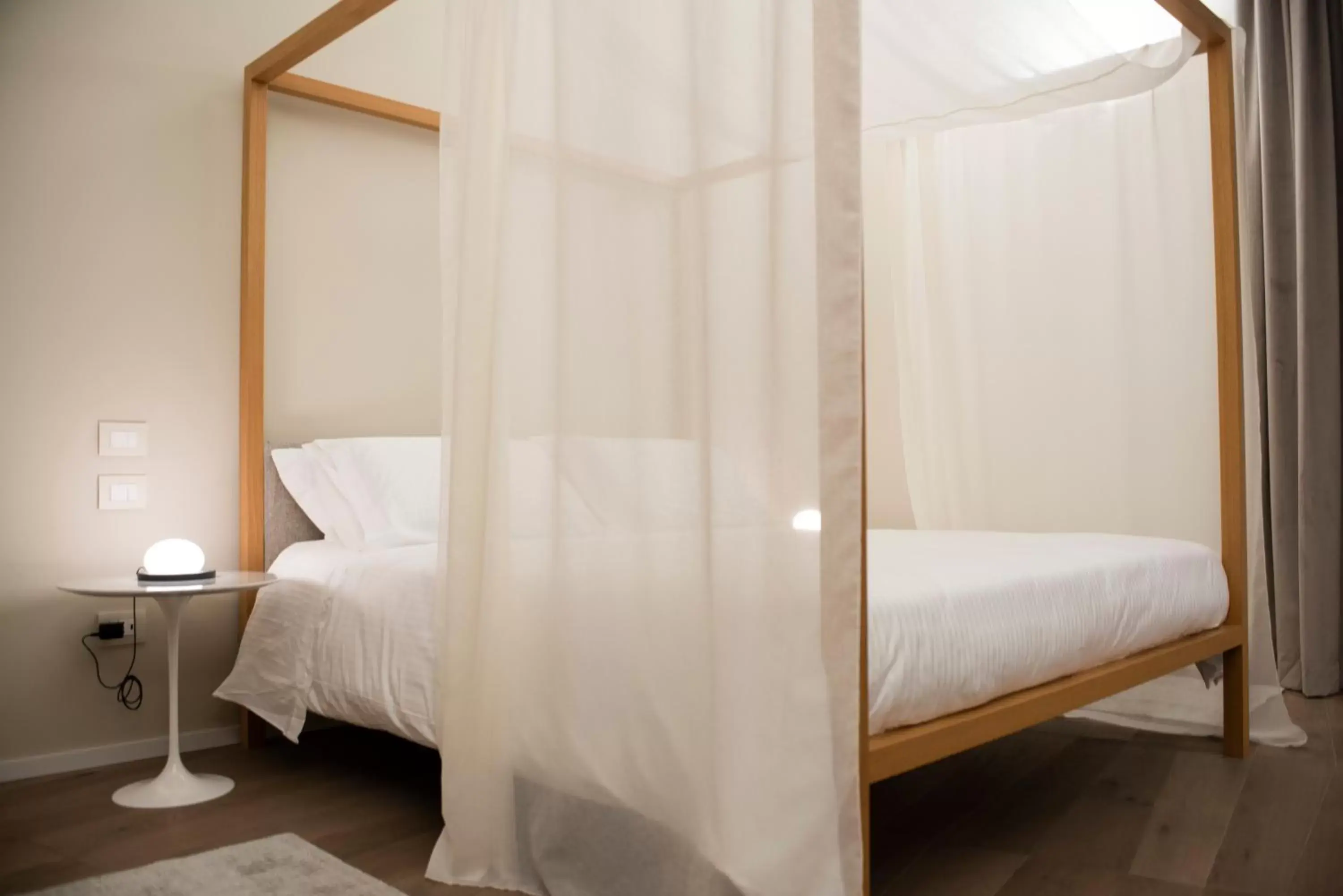 Bed in Dimora de Matera Luxury Suites