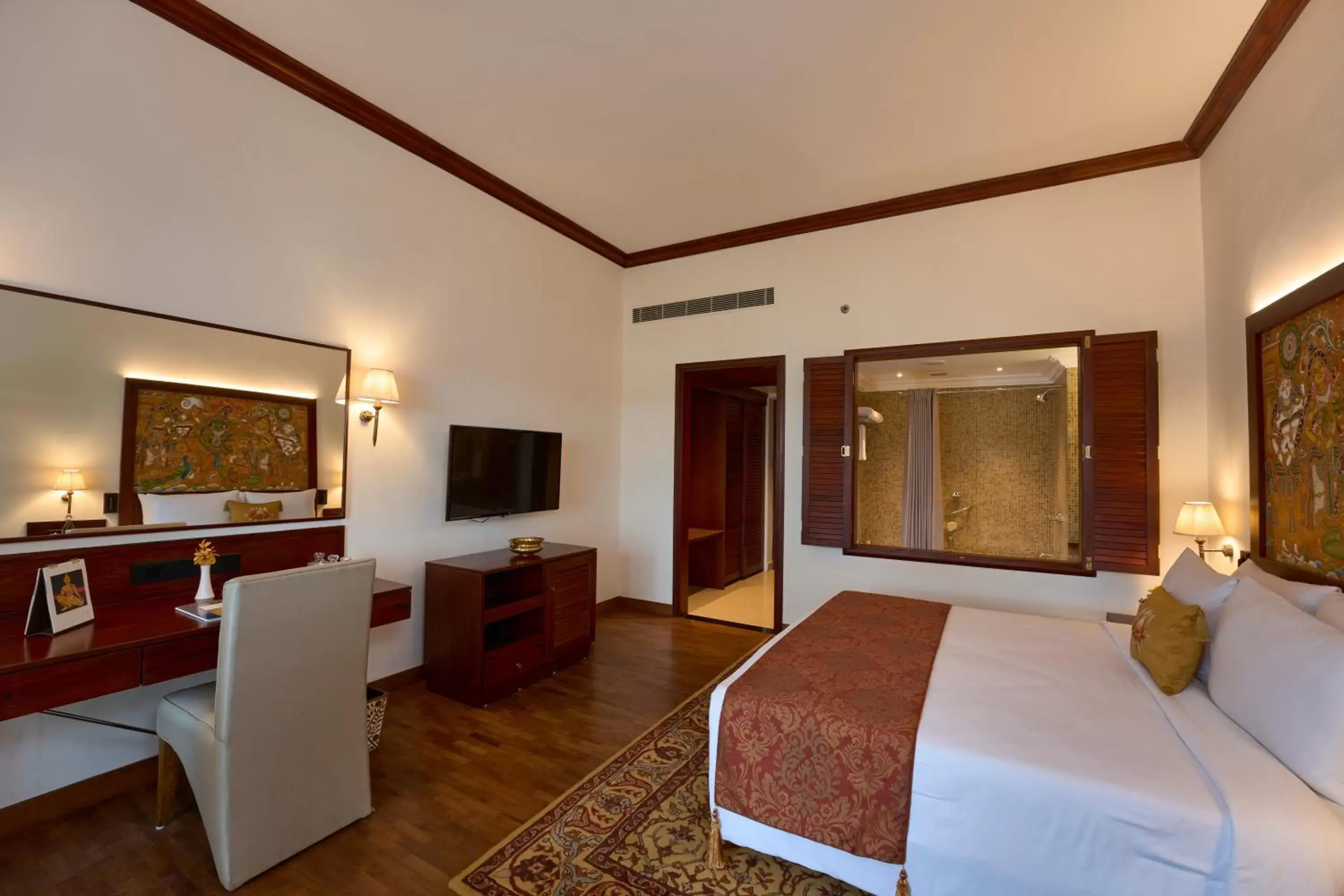 Bed, TV/Entertainment Center in The Leela Ashtamudi, A Raviz Hotel