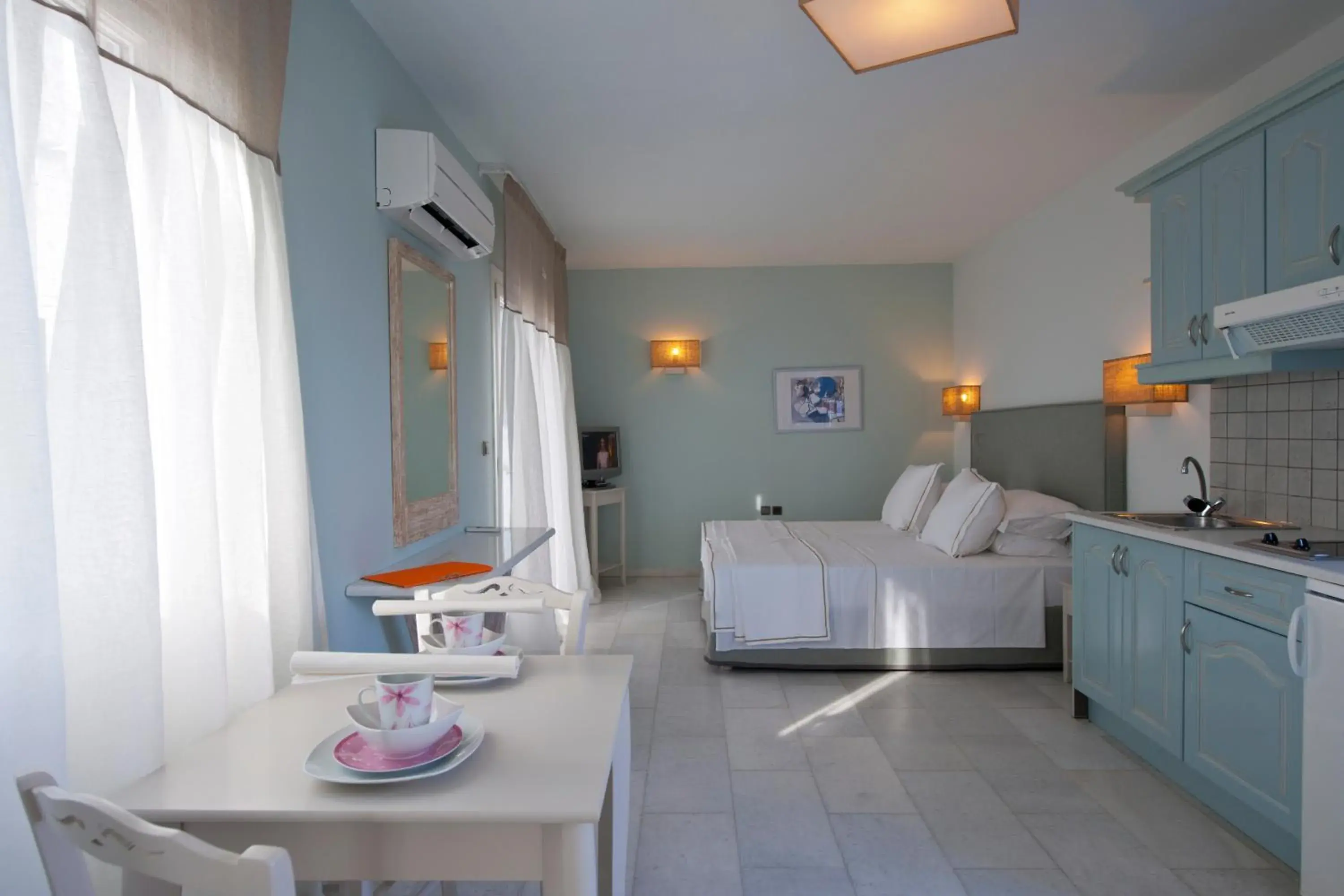 Photo of the whole room in Ammos Naxos Exclusive Apartment