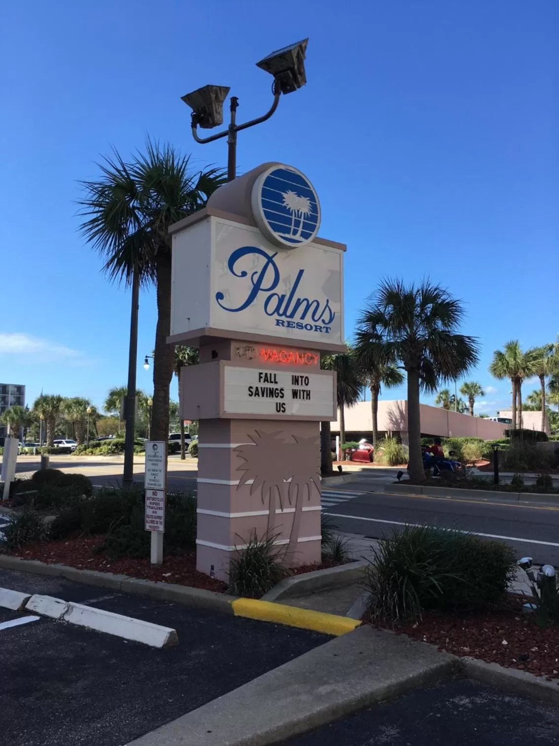 Property logo or sign in Suites at the Beach