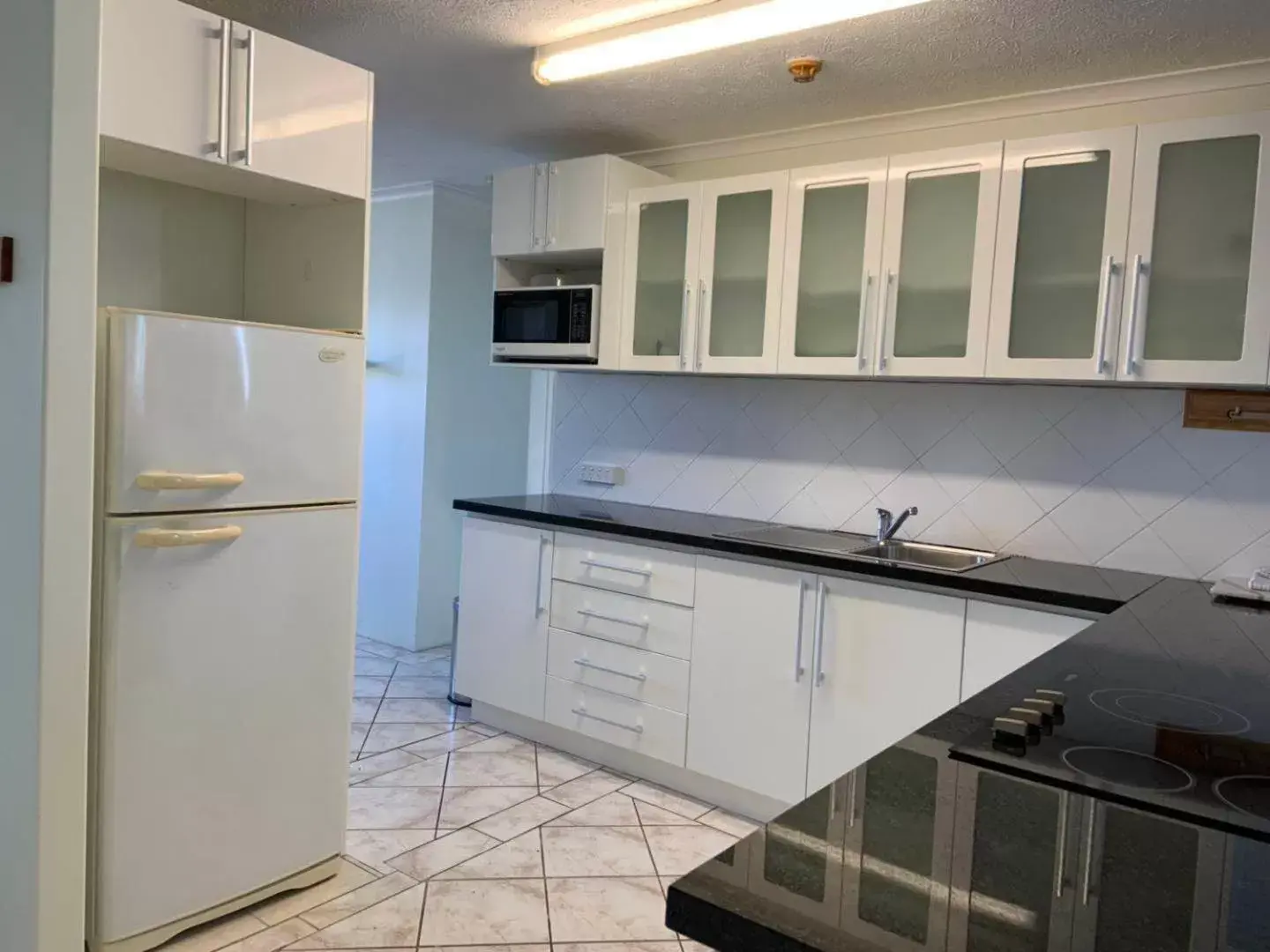 Kitchen/Kitchenette in Burleigh Gardens North Hi-Rise Holiday Apartments