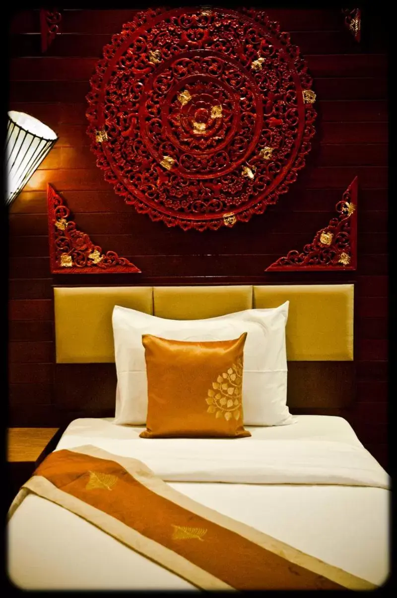 Bed in Ruenkanok Thaihouse Resort Bed in Ruenkanok Thaihouse Resort