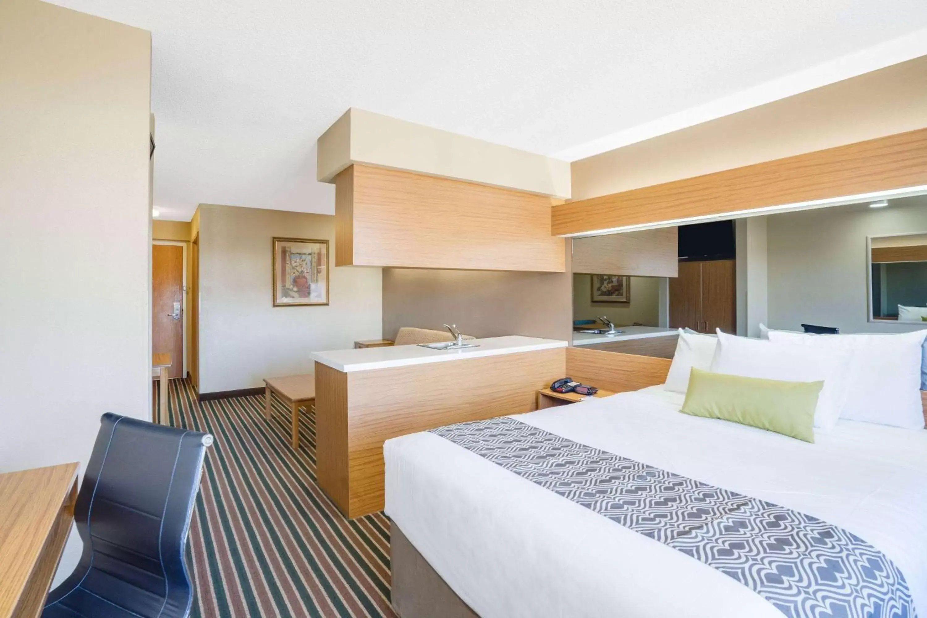 Bed in Microtel Inn & Suites by Wyndham Pigeon Forge
