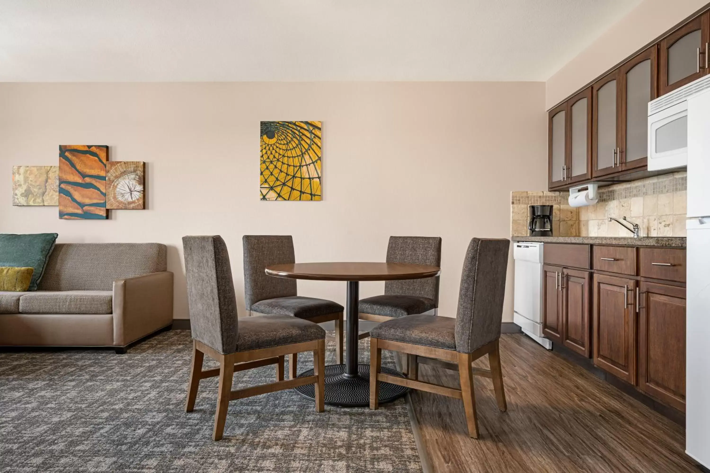 Kitchen or kitchenette, Dining Area in Staybridge Suites Oklahoma City-Quail Springs, an IHG Hotel