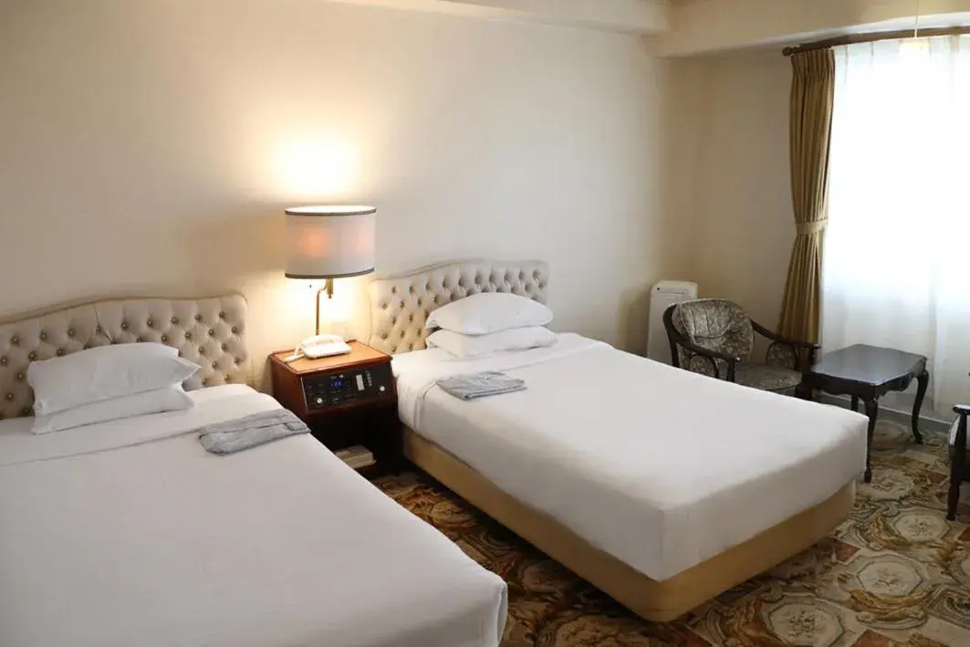 Bed in Koyo Grand Hotel