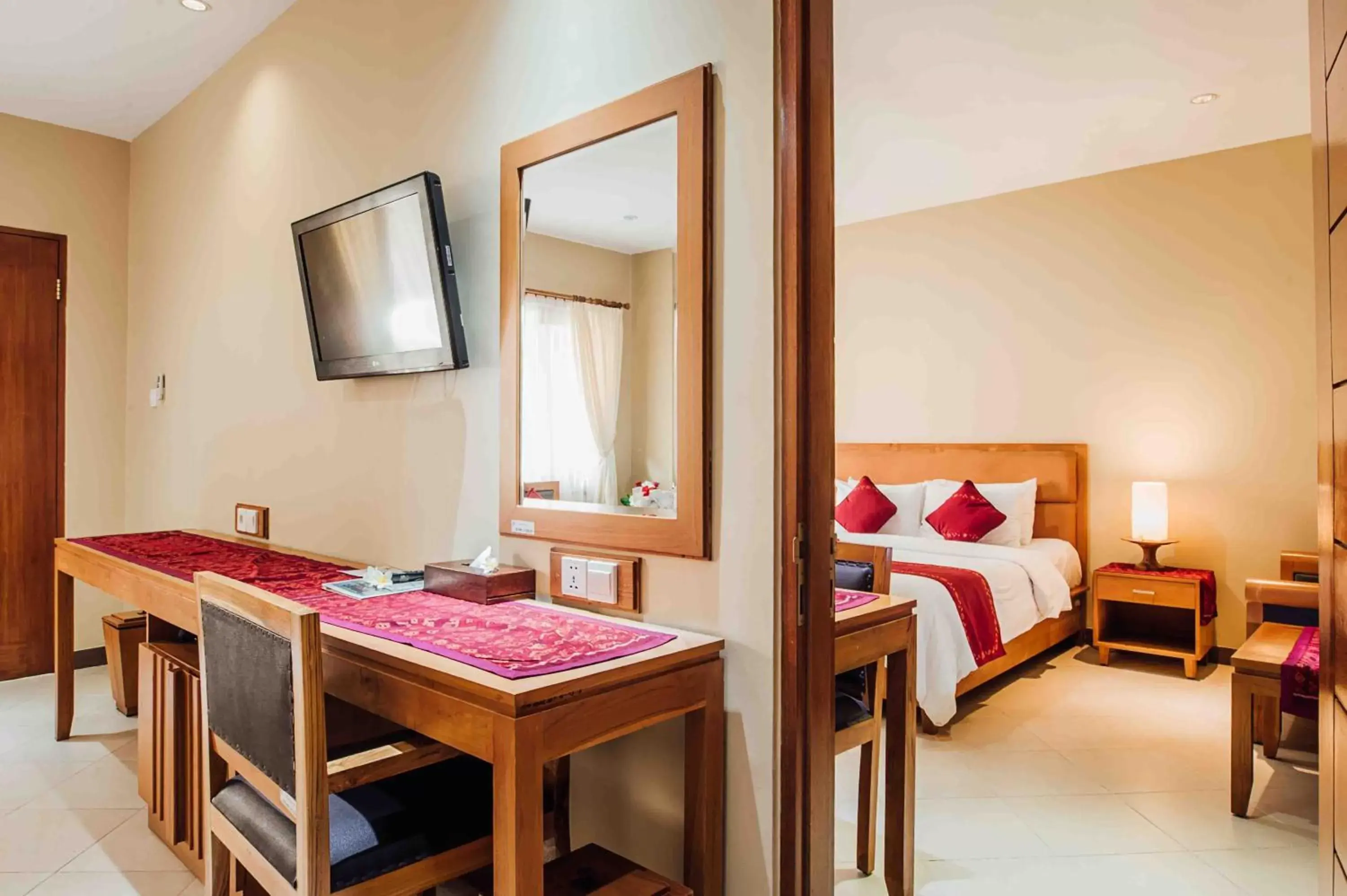 Bedroom, TV/Entertainment Center in Kuta Puri Bungalows, Villas and Resort