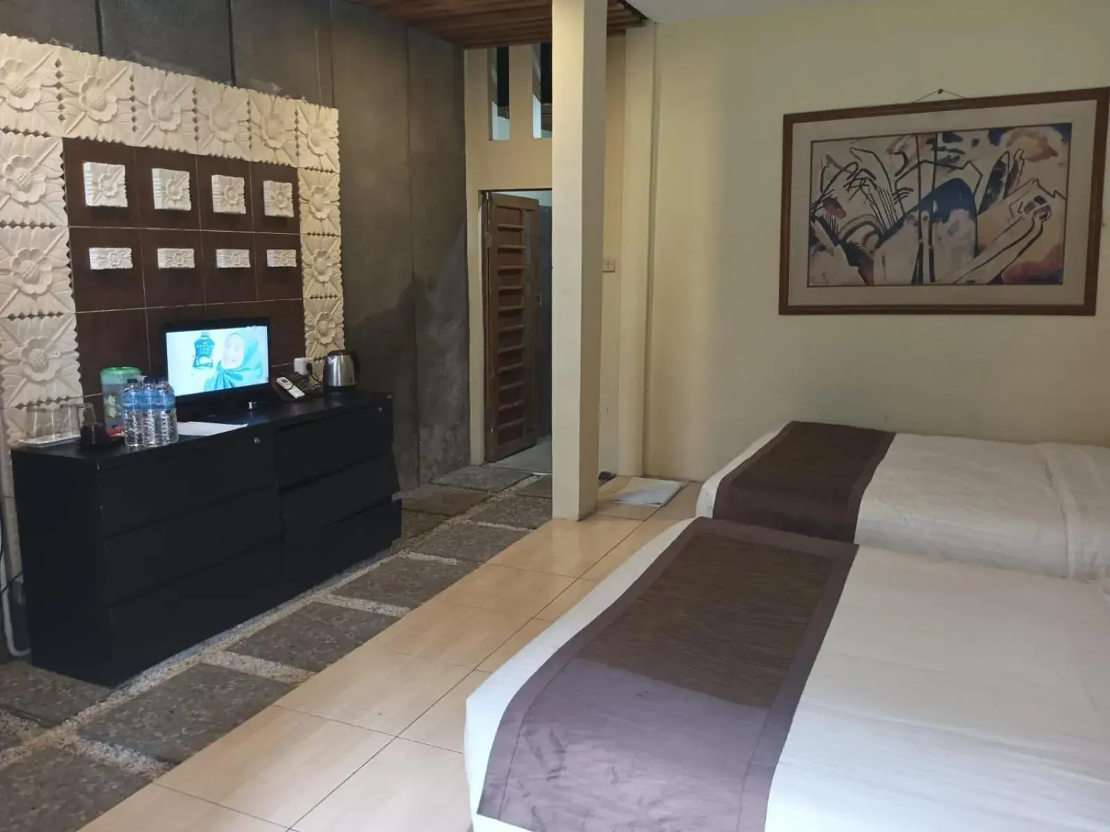 Bed, TV/Entertainment Center in The Village Resort Bogor By Waringin Hospitality