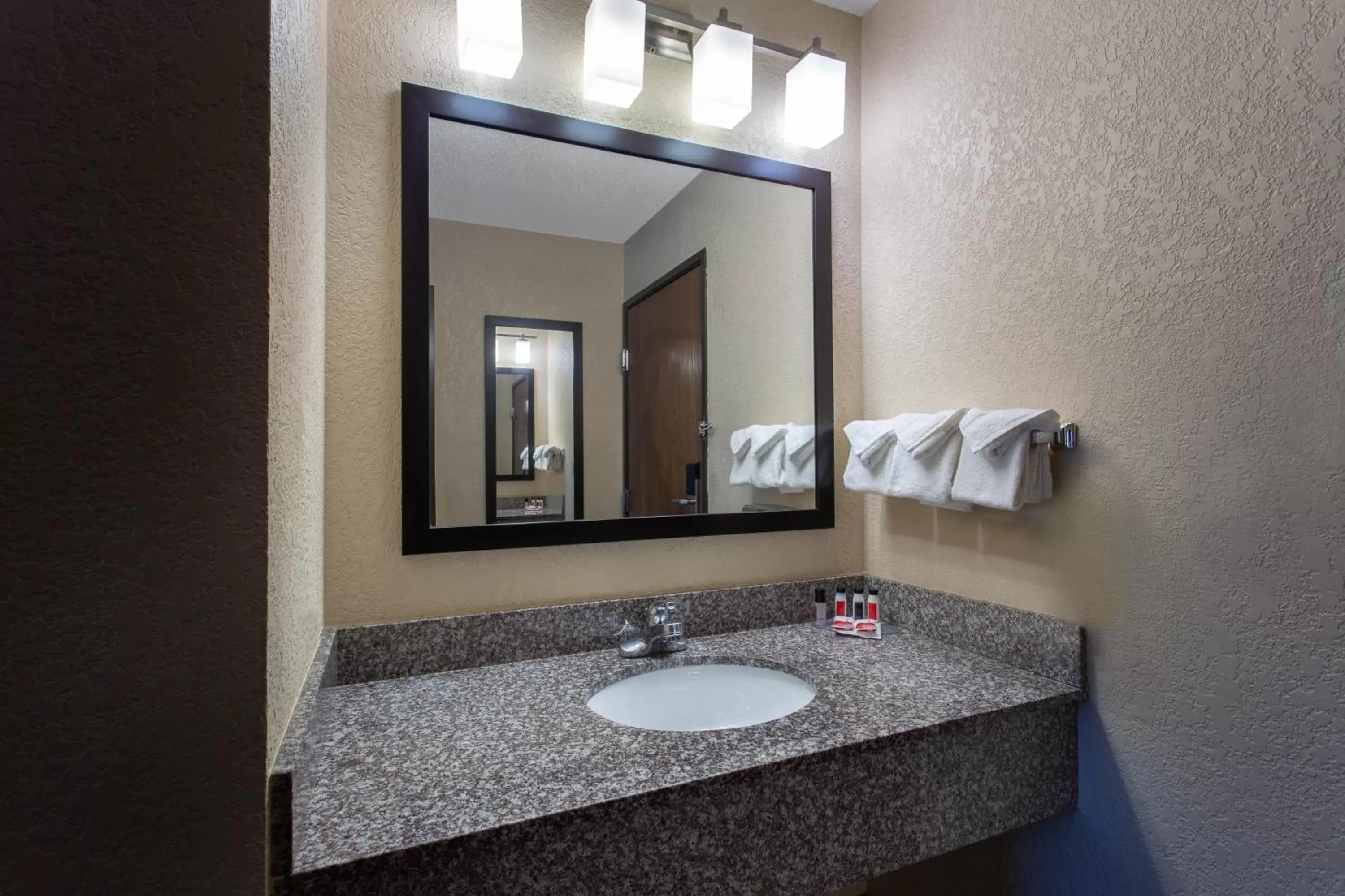Bathroom in Ramada by Wyndham Glendale Heights/Lombard