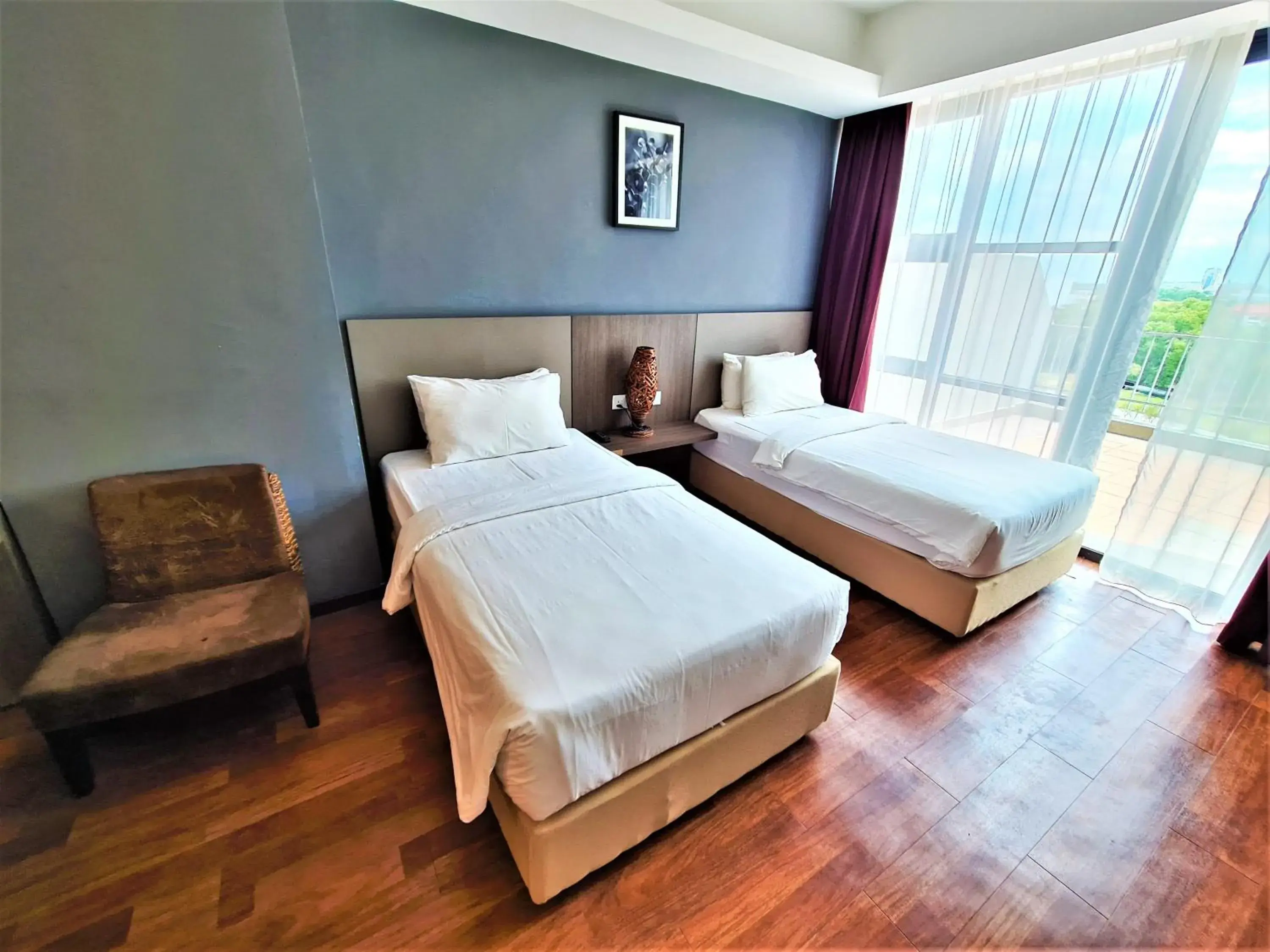 Bed in Nexus Regency Suites & Hotel