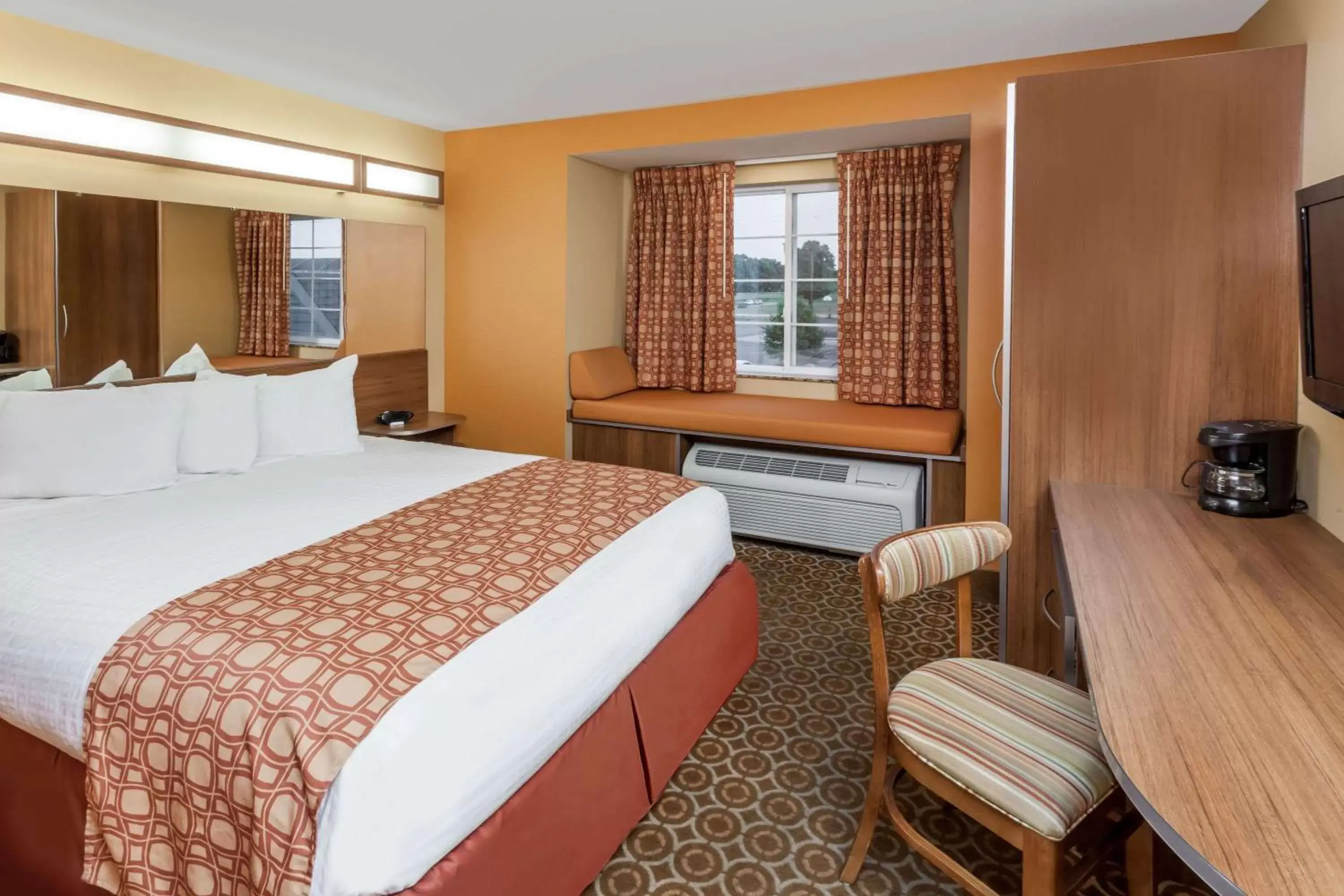 Photo of the whole room, Bed in Microtel by Wyndham South Bend Notre Dame University