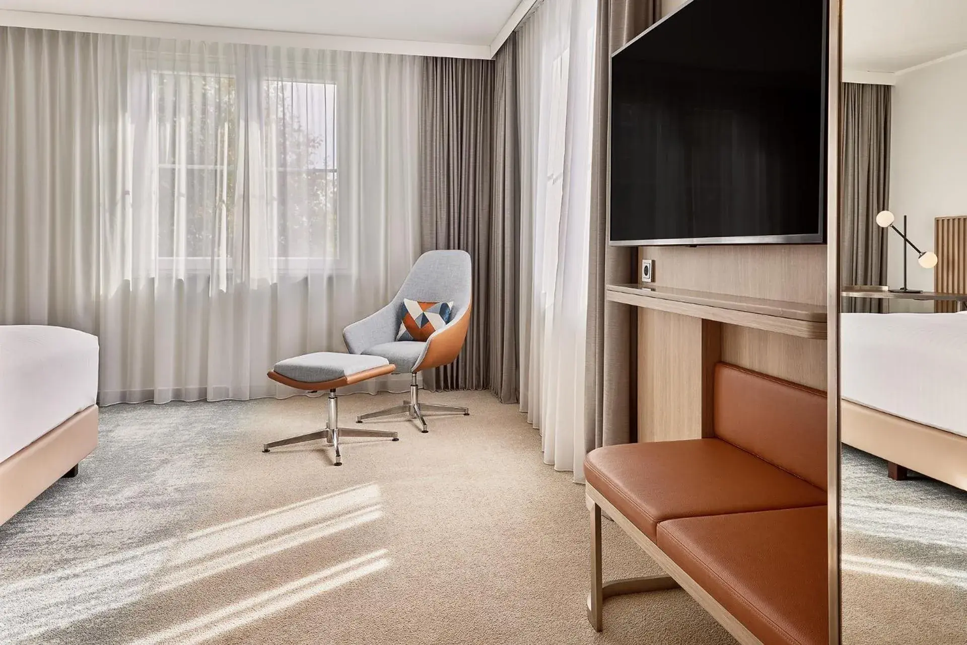Seating area, TV/Entertainment Center in Courtyard by Marriott Dortmund