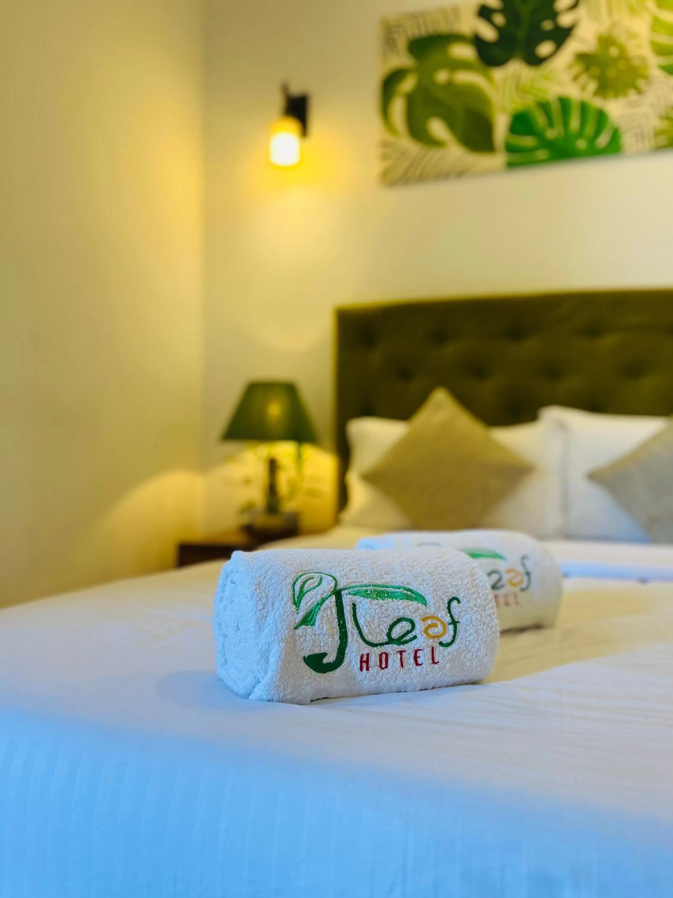 Bed in J leaf Hotel by Blue Bird