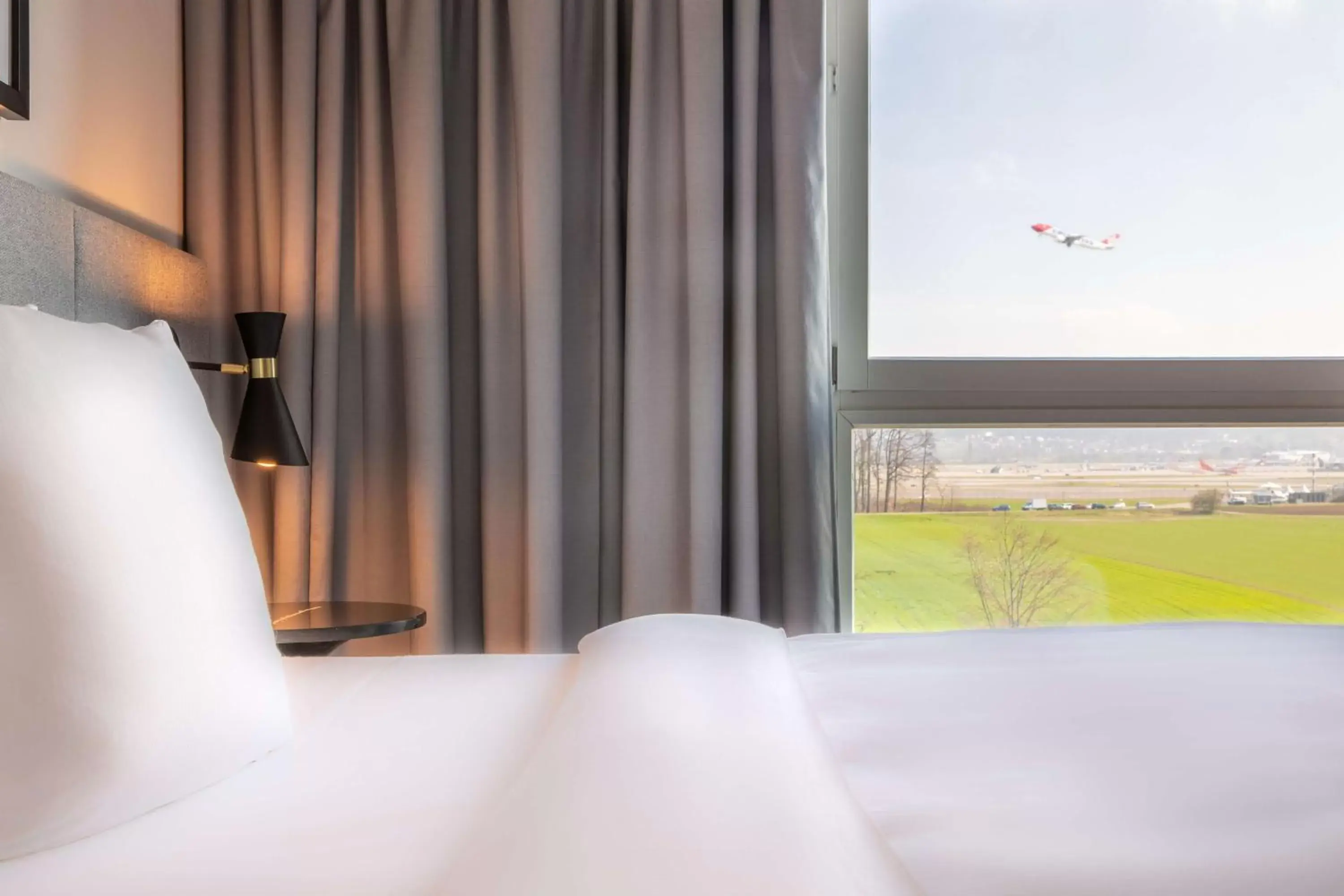 Photo of the whole room, Bed in Radisson Hotel Zurich Airport