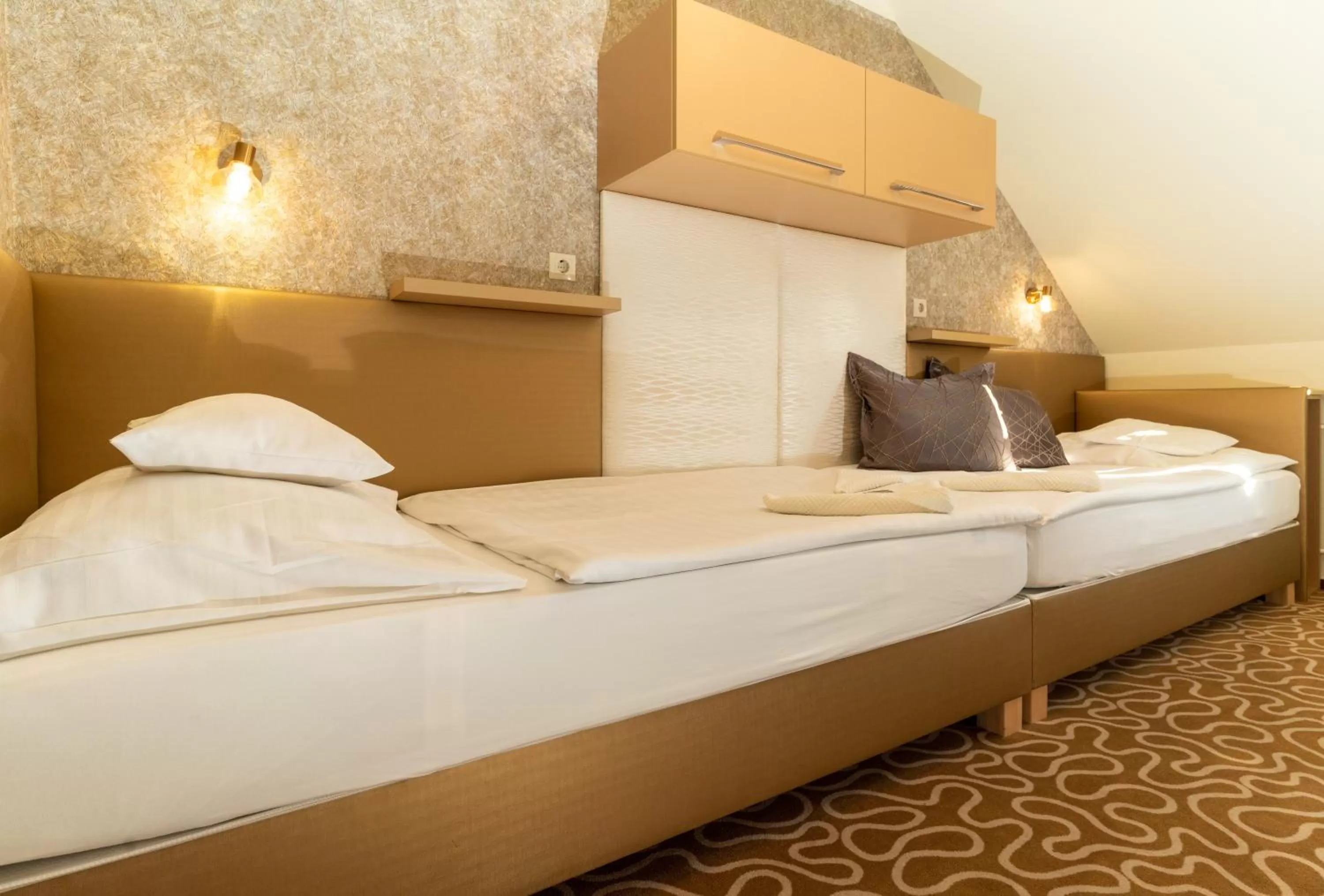 Bed in Teátrum Boutique Hotel