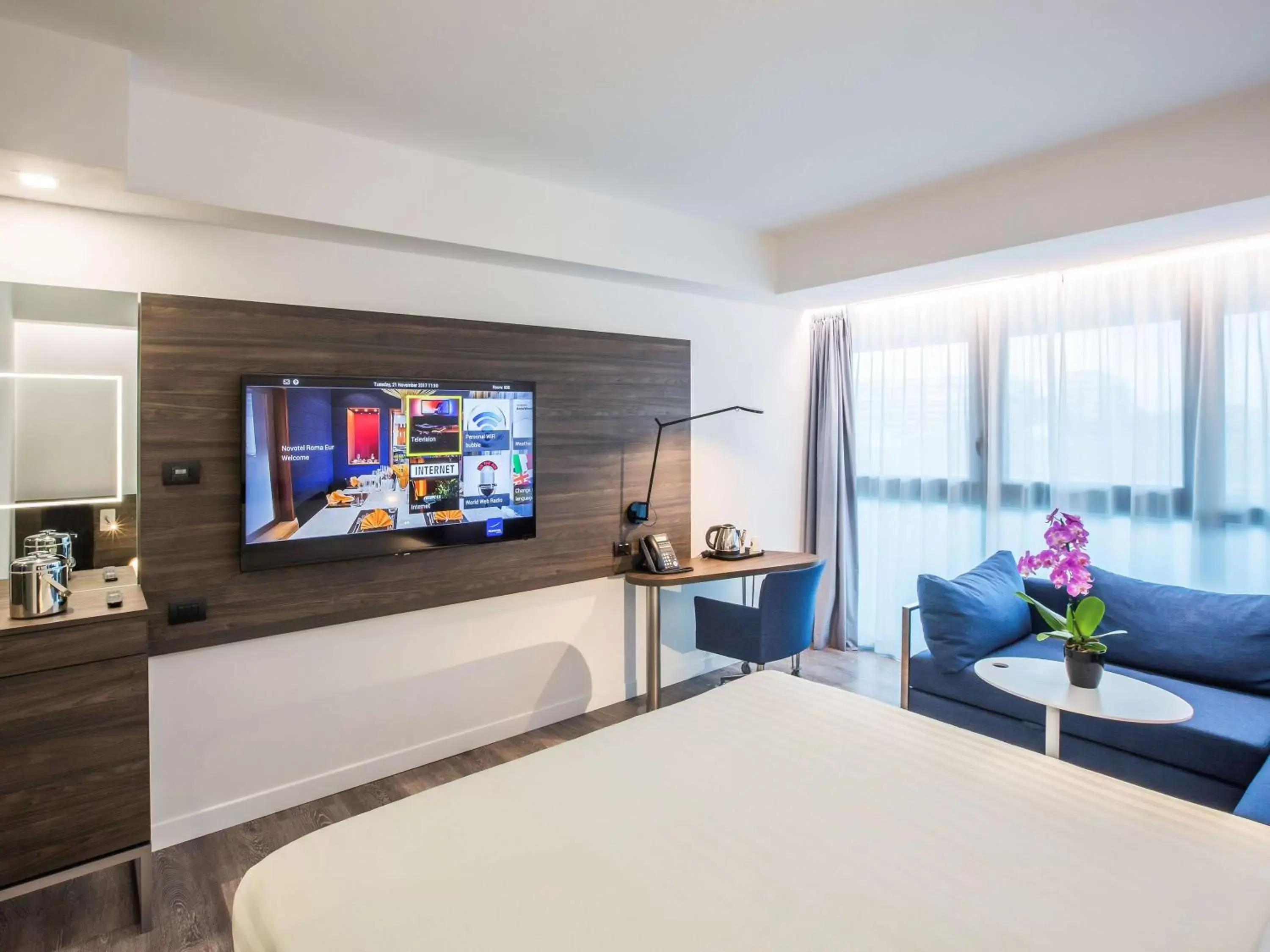 Photo of the whole room, TV/Entertainment Center in Novotel Roma Eur
