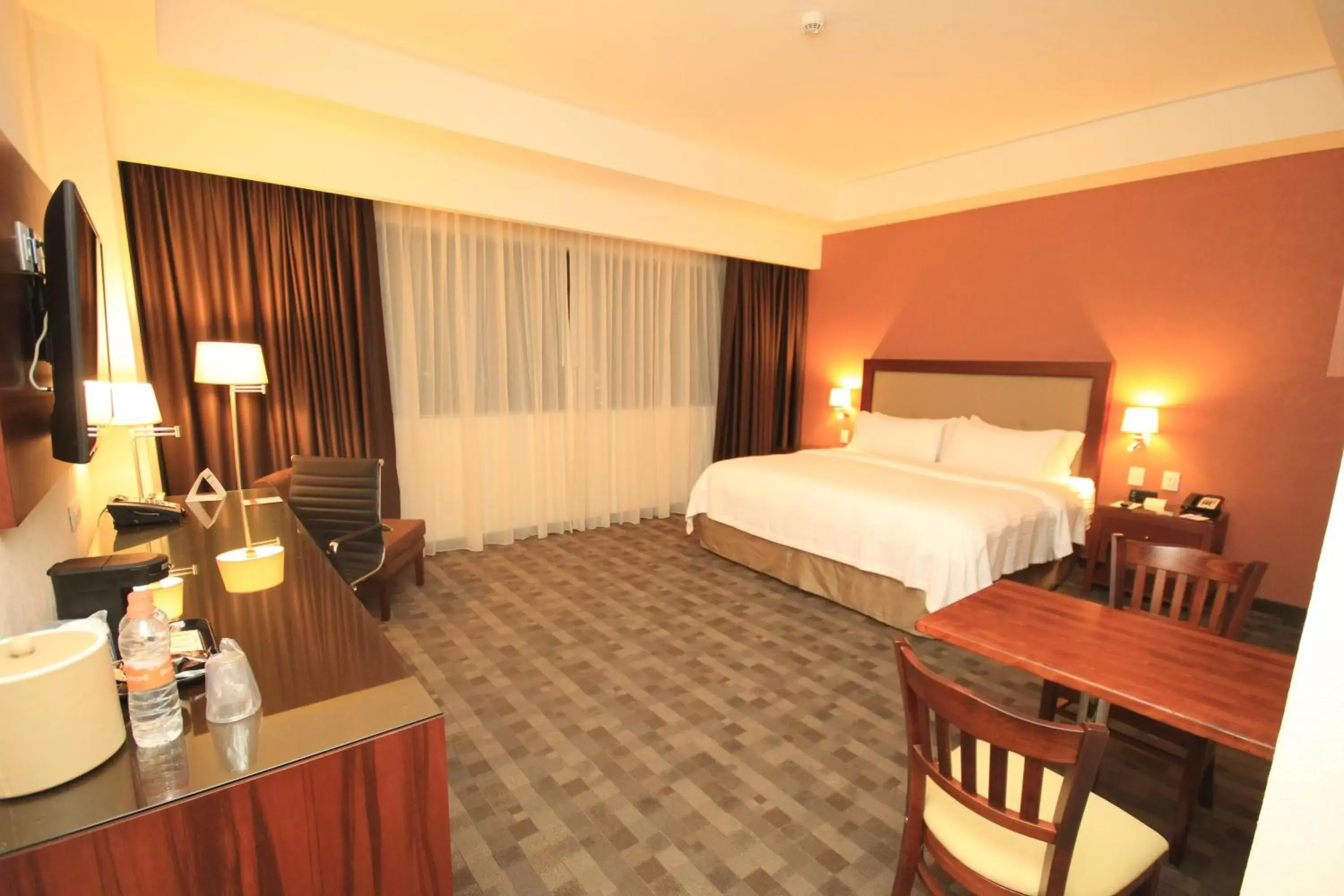 Photo of the whole room, Bed in Holiday Inn & Suites Plaza Mayor, an IHG Hotel