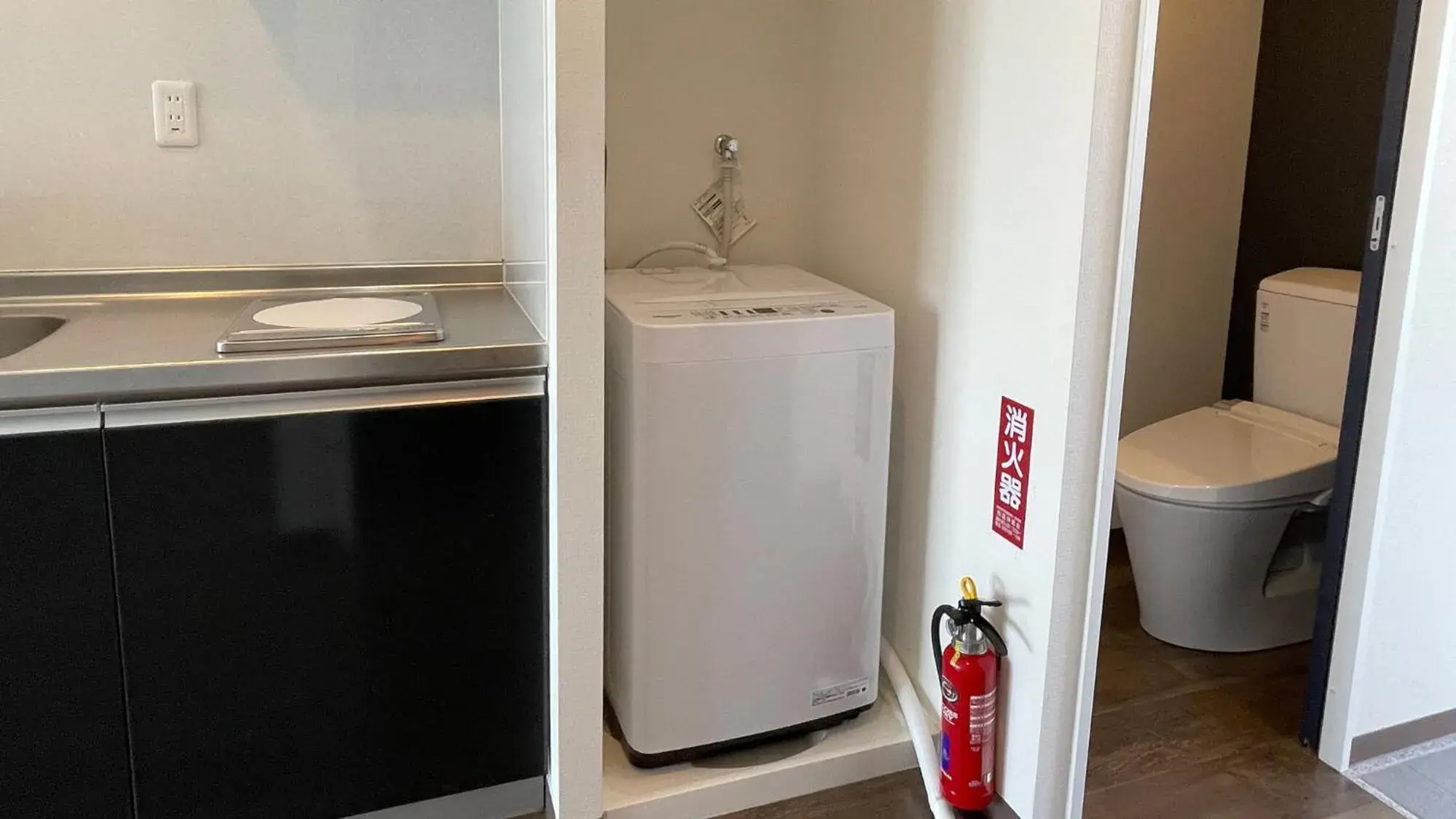 Kitchen or kitchenette, Bathroom in New Normal Hotel in NAMINOUE