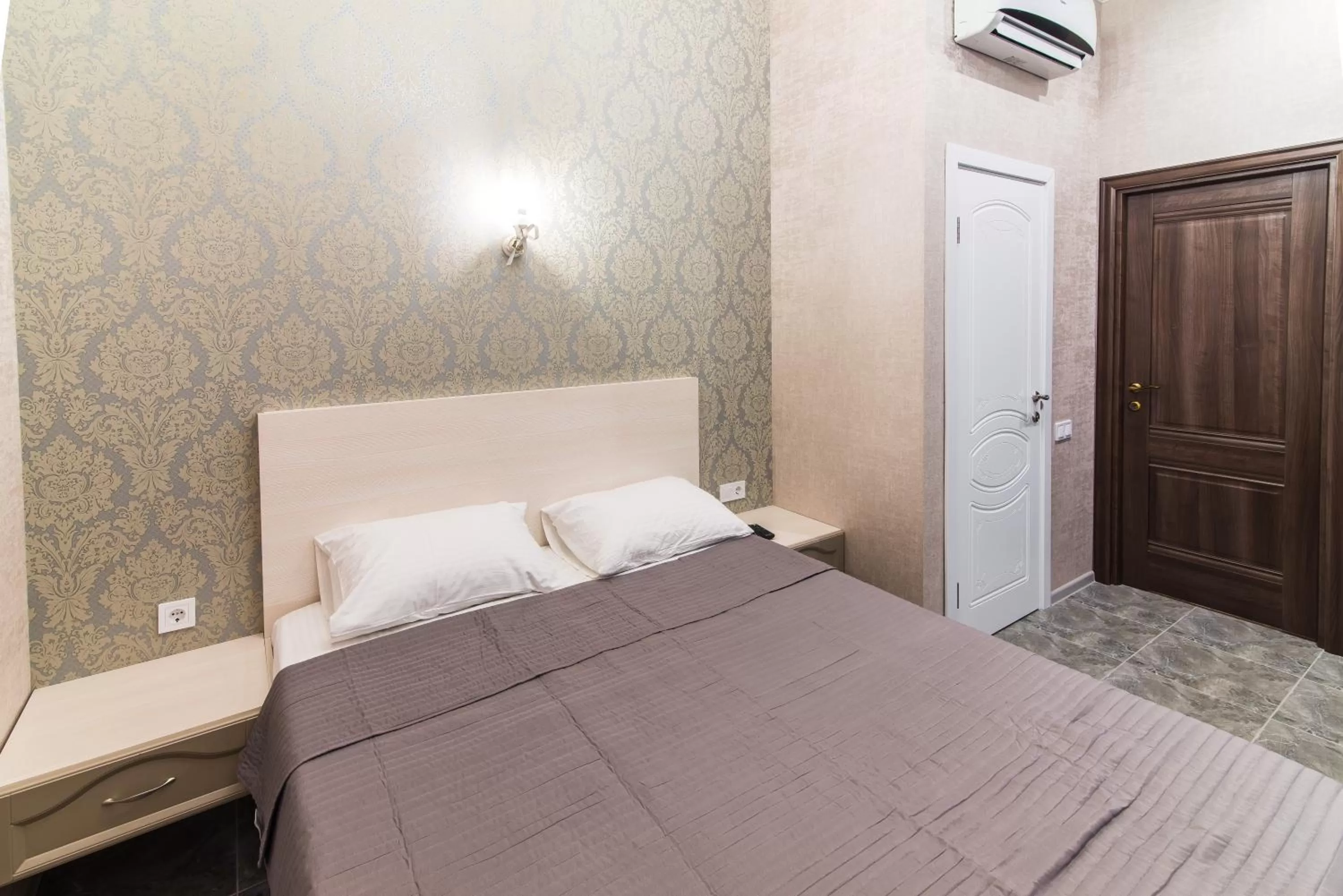 Bed in L.O.Y Family Hotel