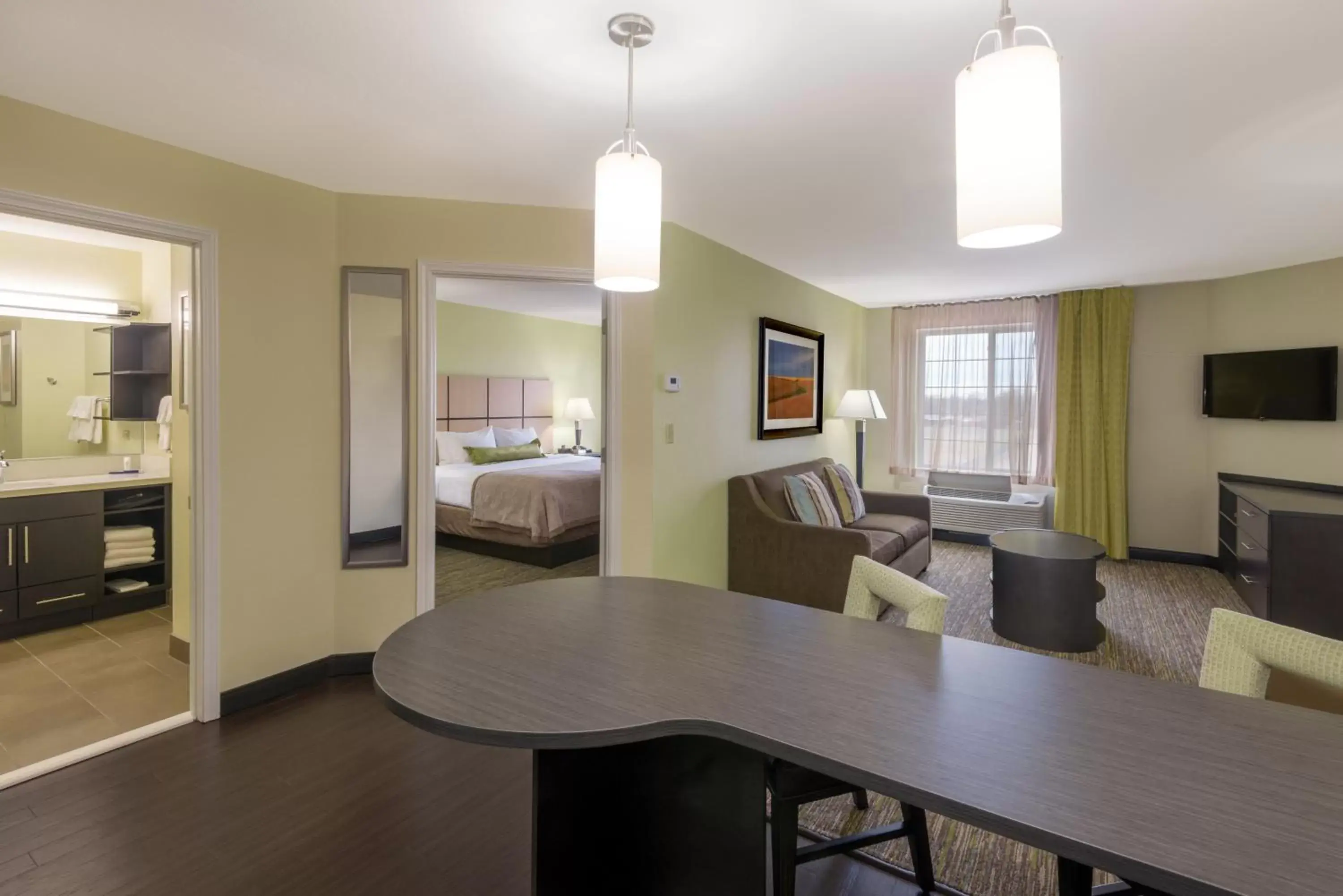 Bedroom, Dining Area in Candlewood Suites Del City, an IHG Hotel