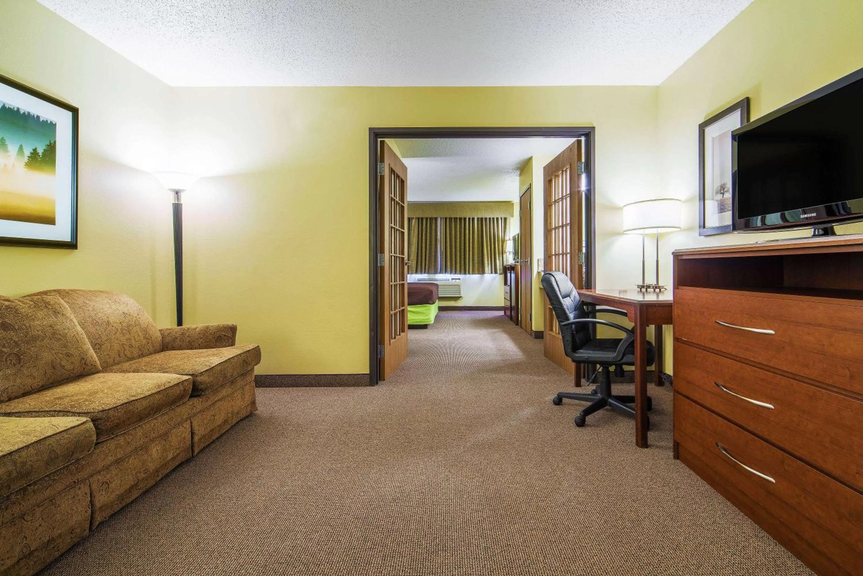 Living room in AmericInn by Wyndham Sioux Falls