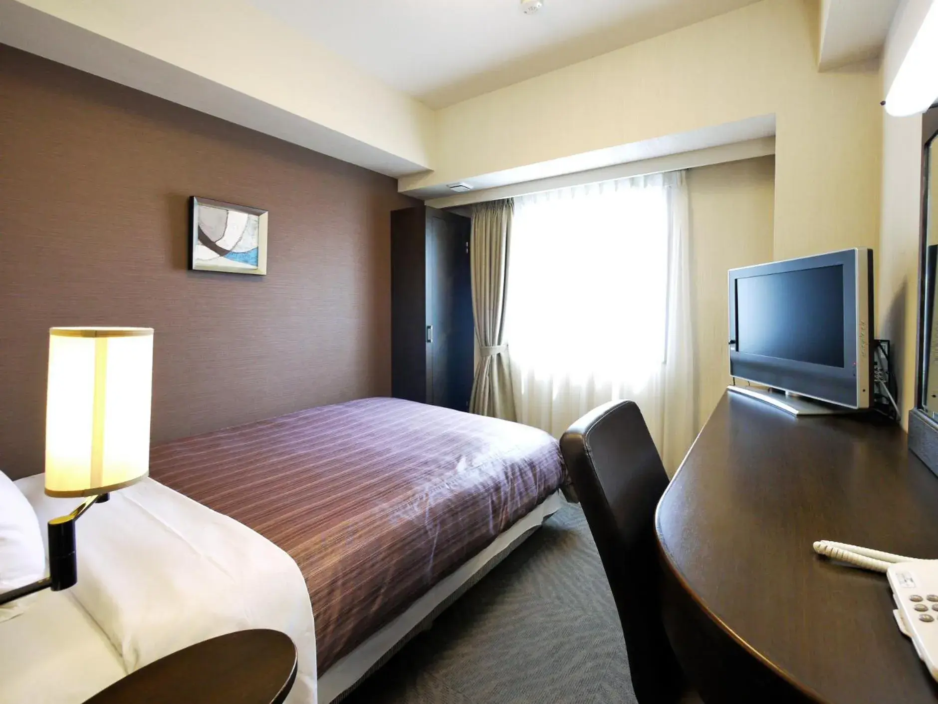 Bed in Hotel Route Inn Tsuruga Ekimae