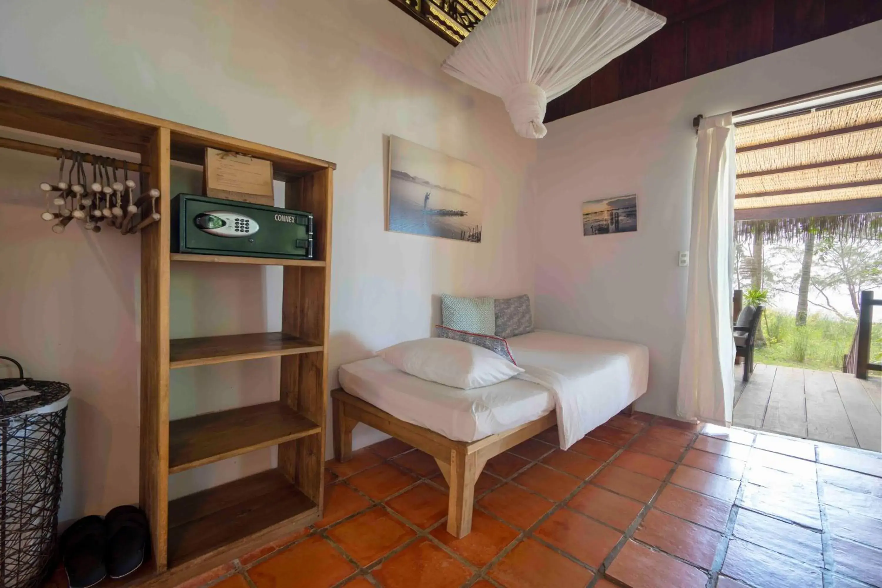 Bed, Seating Area in Mango Bay Resort