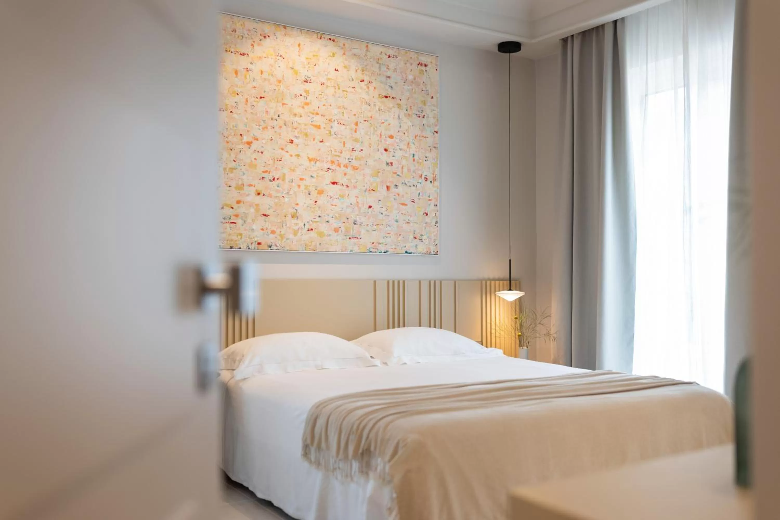 Bed in Taodomus Boutique Hotel