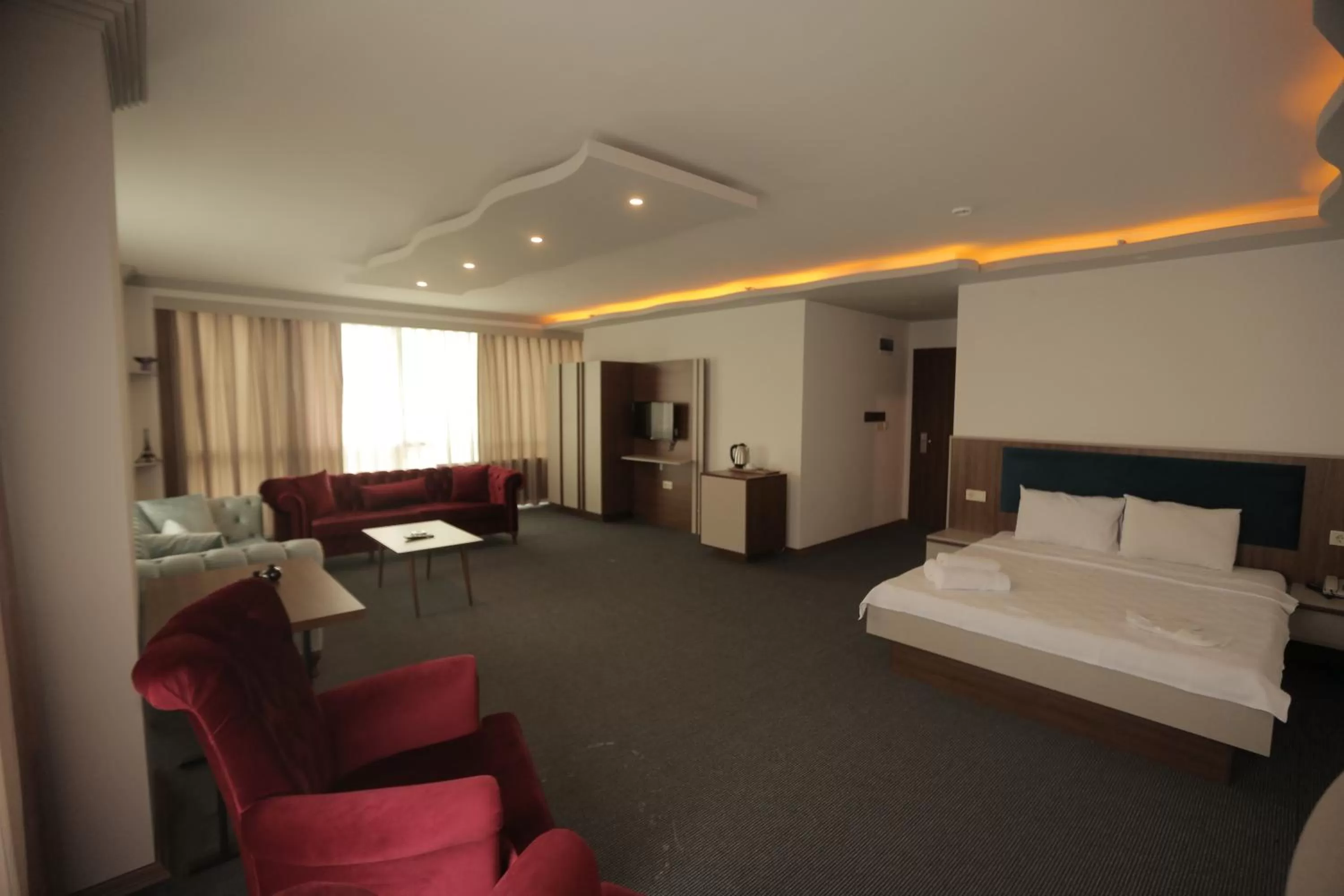 Bed in TEVETOGLU HOTEL