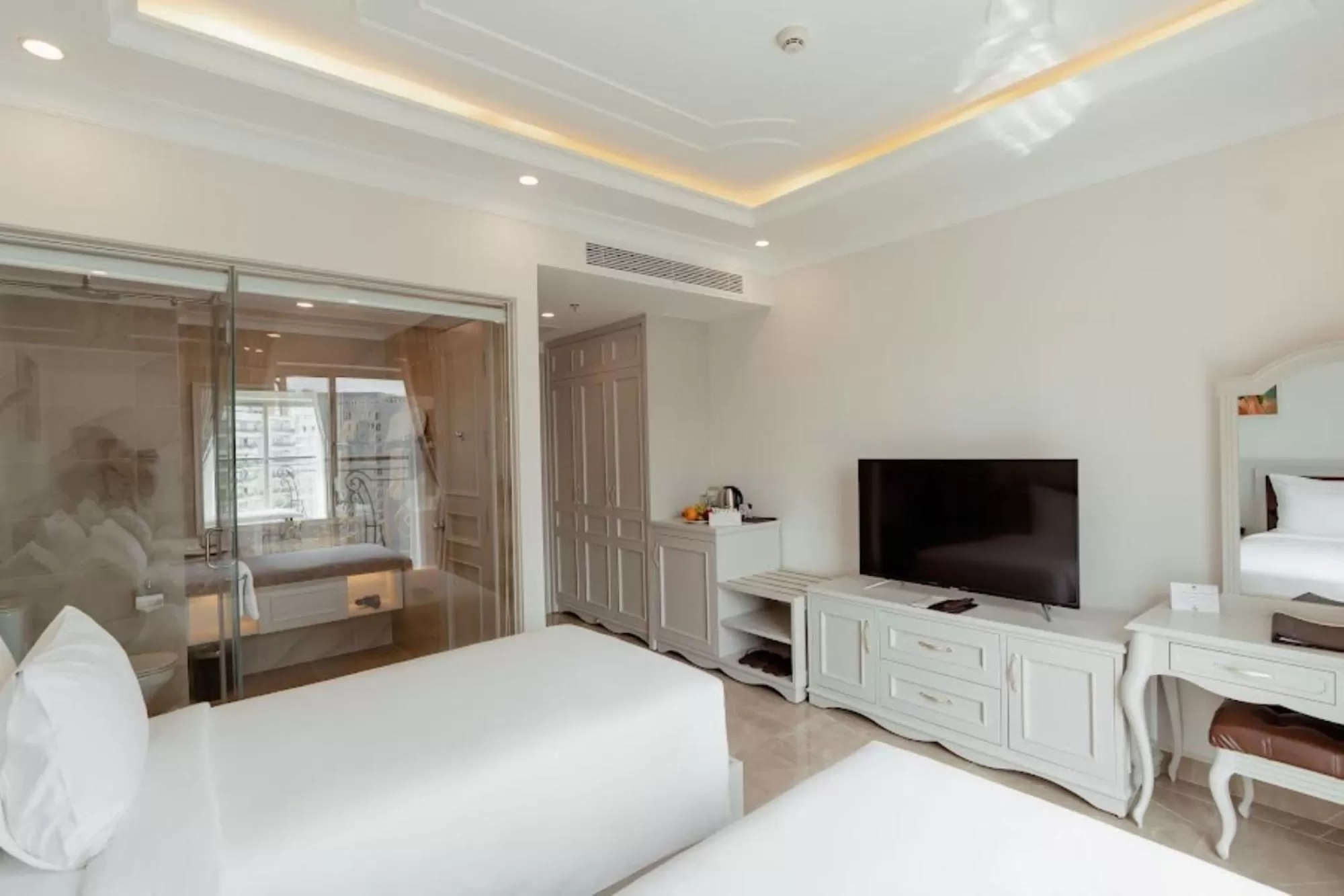 Photo of the whole room, TV/Entertainment Center in MerPerle Beach Hotel