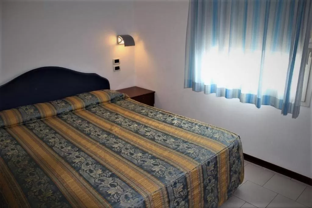 Bed in Hotel Riverside