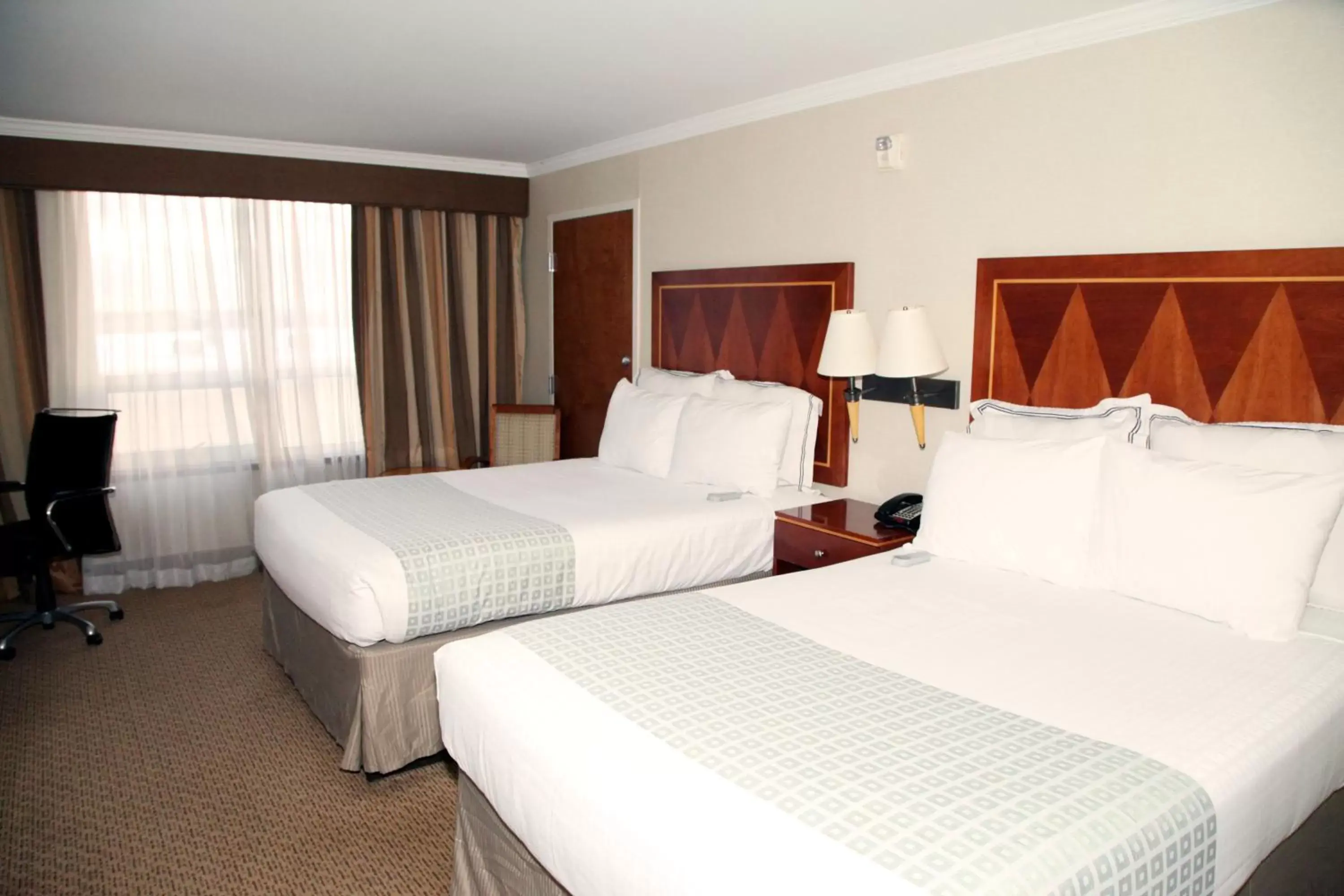 Bed in Hotel Executive Suites