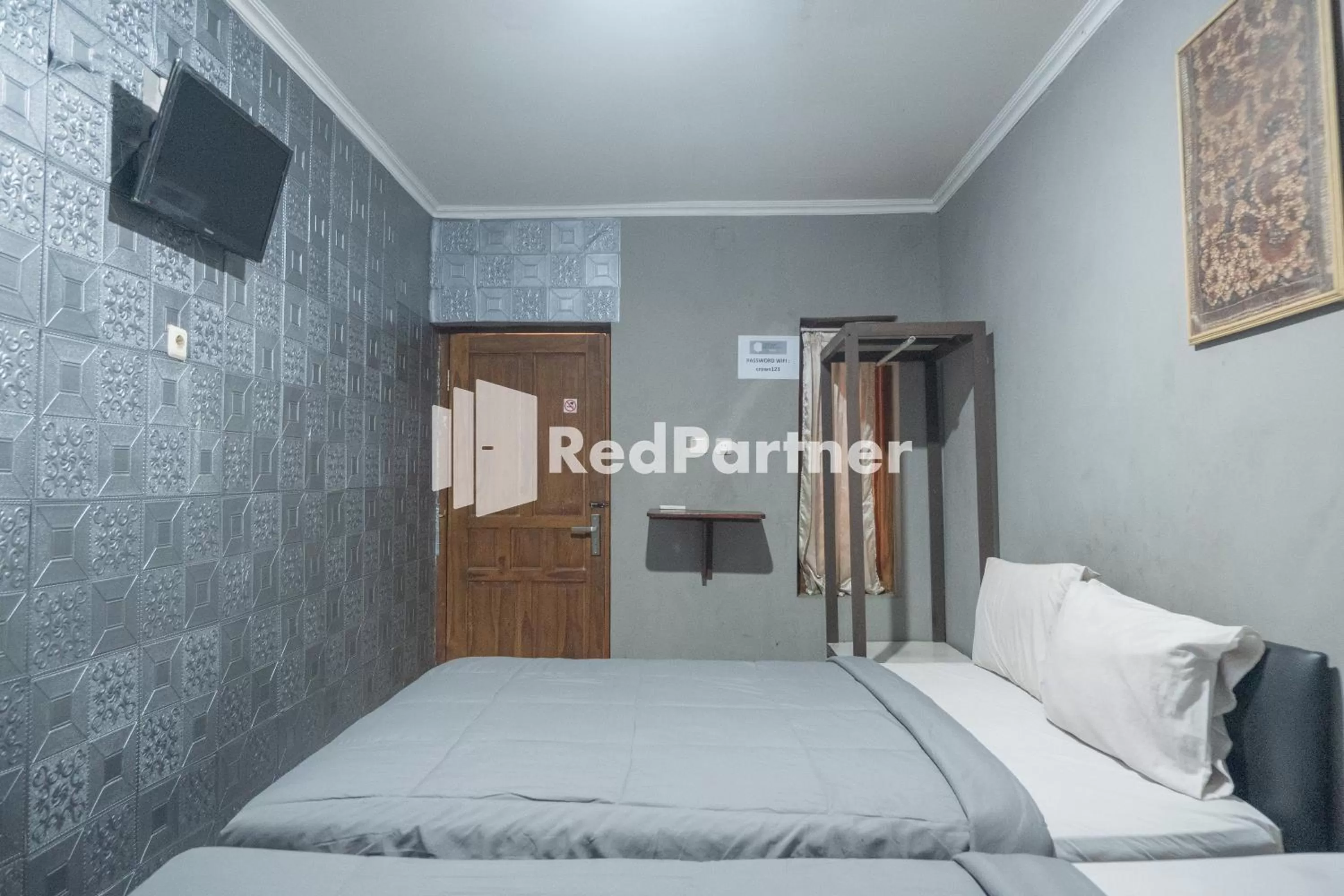 Bedroom, Bed in Crown Residence near Tugu Yogyakarta RedPartner