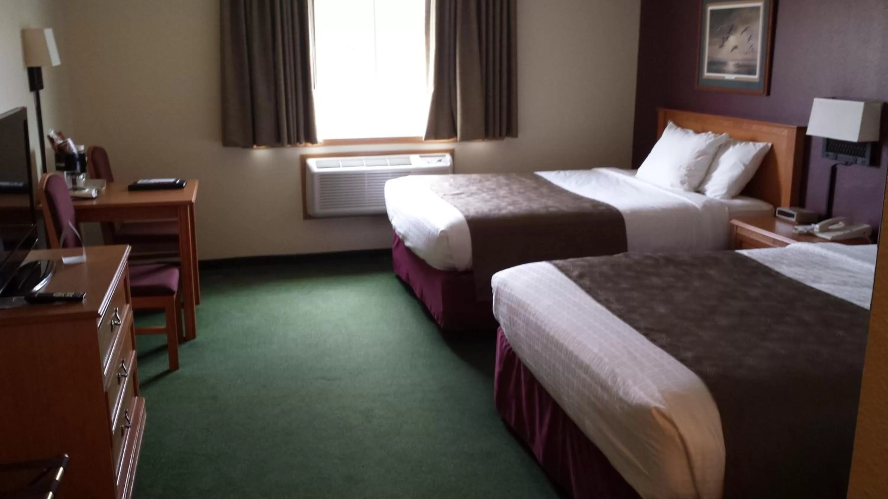 Bed in AmericInn by Wyndham Madison SD