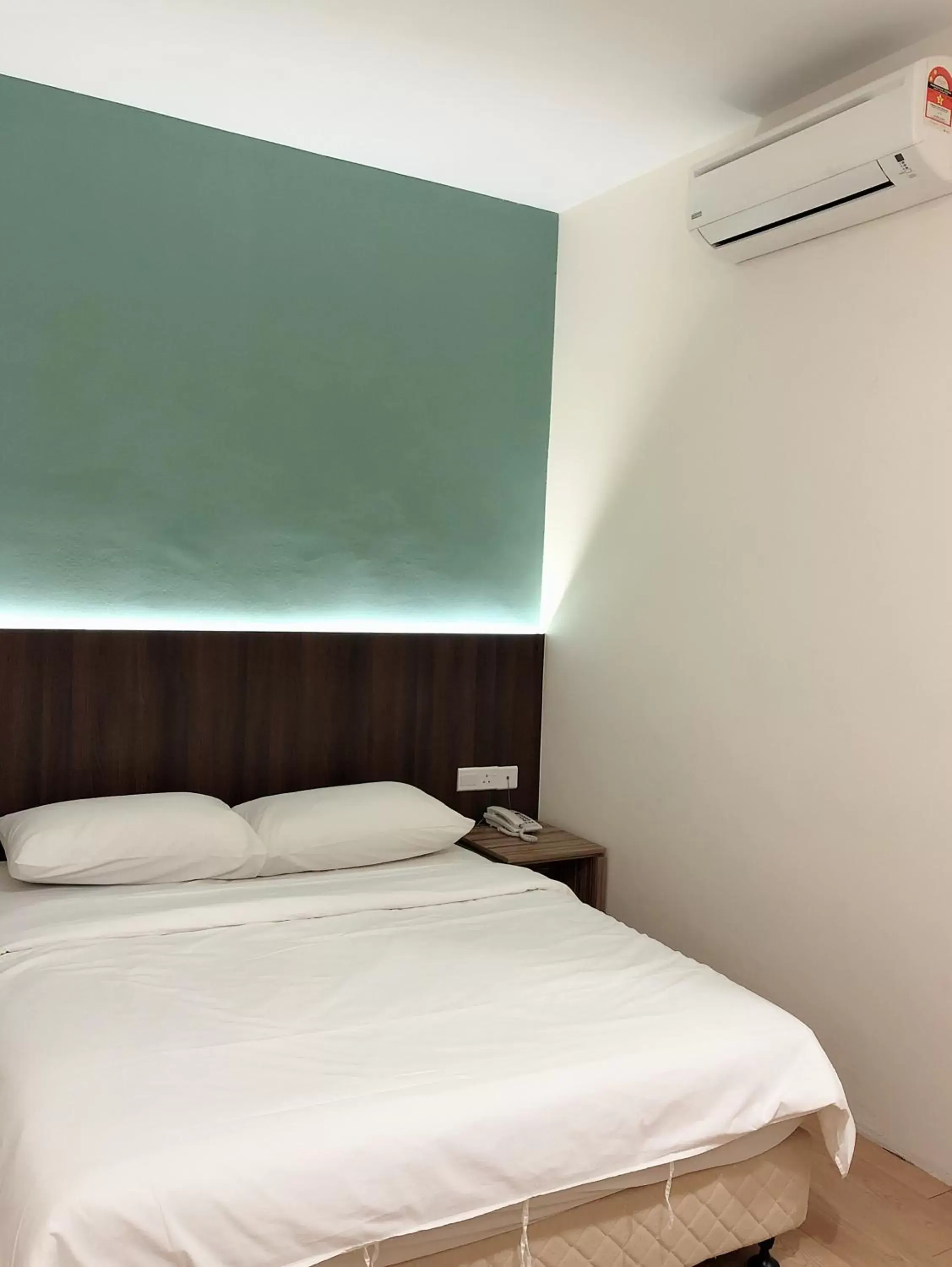 Bed in Tumike Hotel Bentong